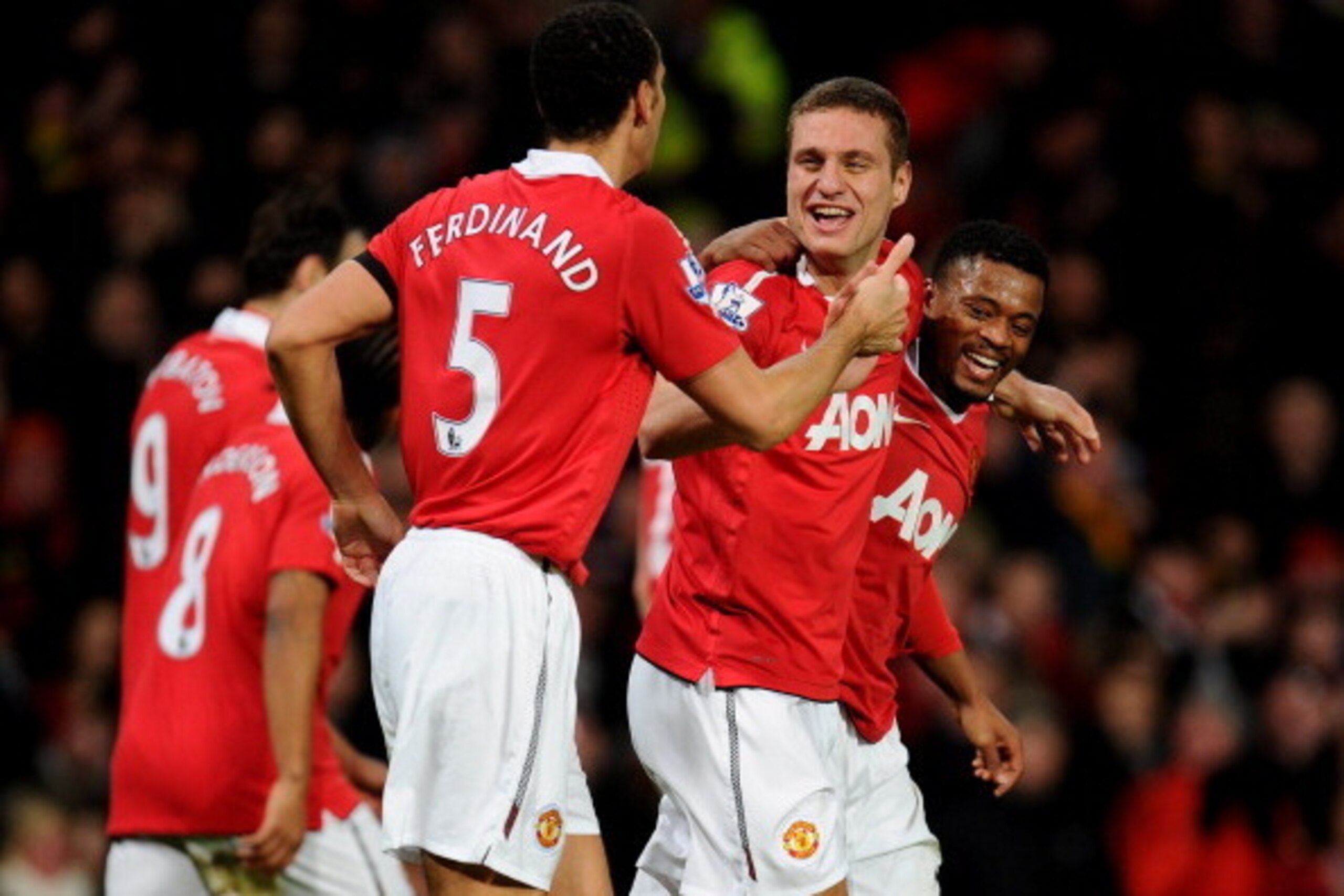 MANCHESTER, ENGLAND - FEBRUARY 01:  Nemanja Vidic of Manchester United celebrates scoring his team's third goal with team mates Rio Ferdinand and Patrice Evra (R) during the Barclays Premier League match between Manchester United and Aston Villa at Old Tr