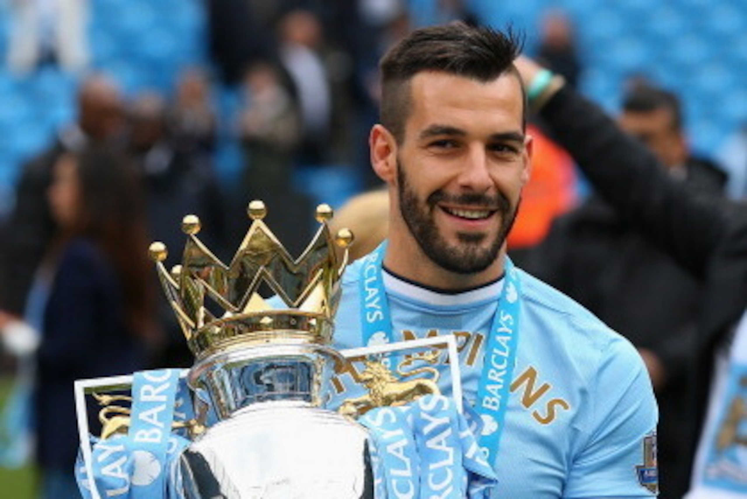 MANCHESTER, ENGLAND - MAY 11:  Alvaro Negredo of Manchester City poses with the trophy at the end of the Barclays Premier League match between Manchester City and West Ham United at the Etihad Stadium on May 11, 2014 in Manchester, England.  (Photo by Ale