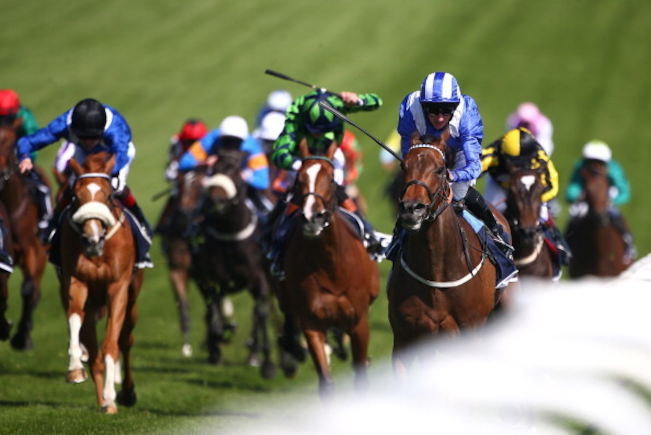EPSOM, ENGLAND - JUNE 06: Paul Hanagan ridding Taghrooda wins The Investec Oaks at Epsom racecourse on June 06, 2014 in Epsom, England. (Photo by Charlie Crowhurst/Getty Images)