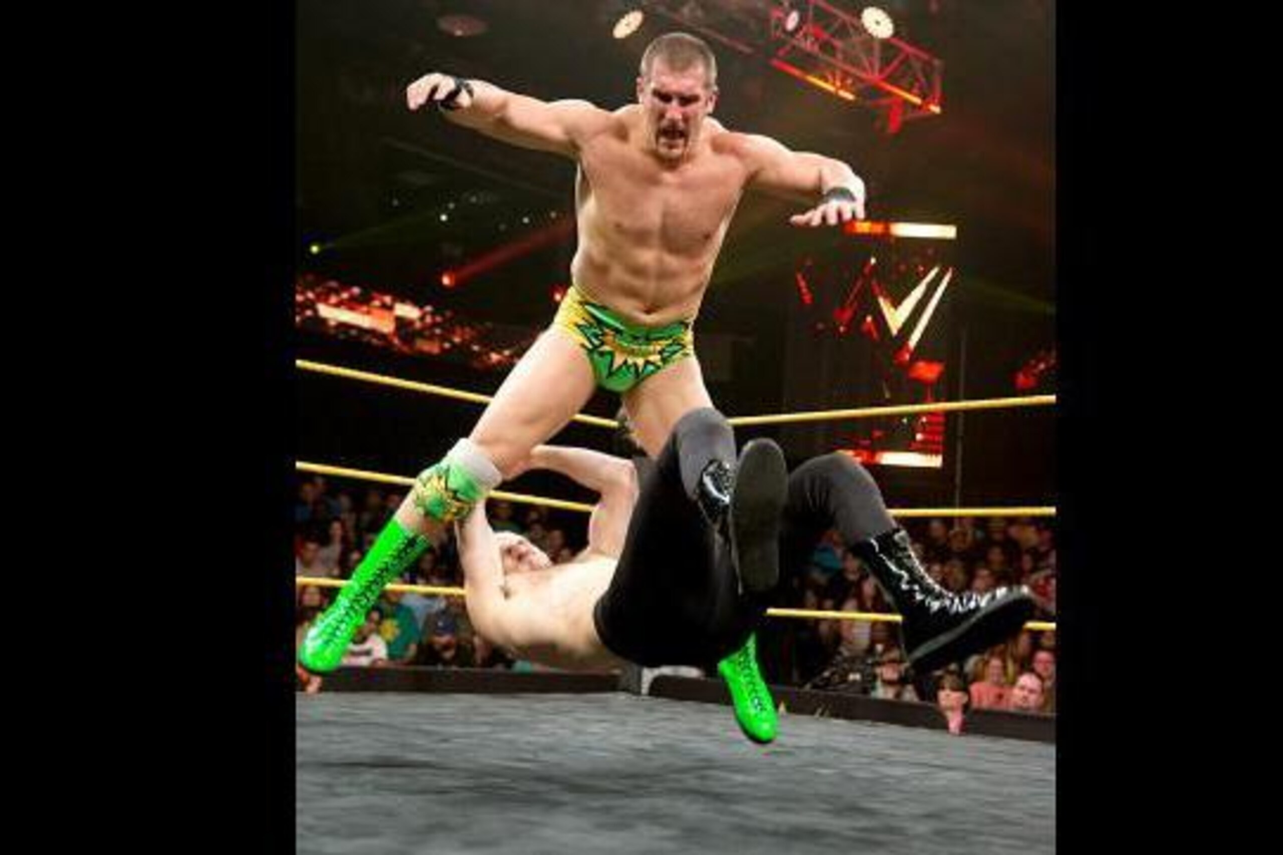 Mojo Rawley bowls Aiden English over.