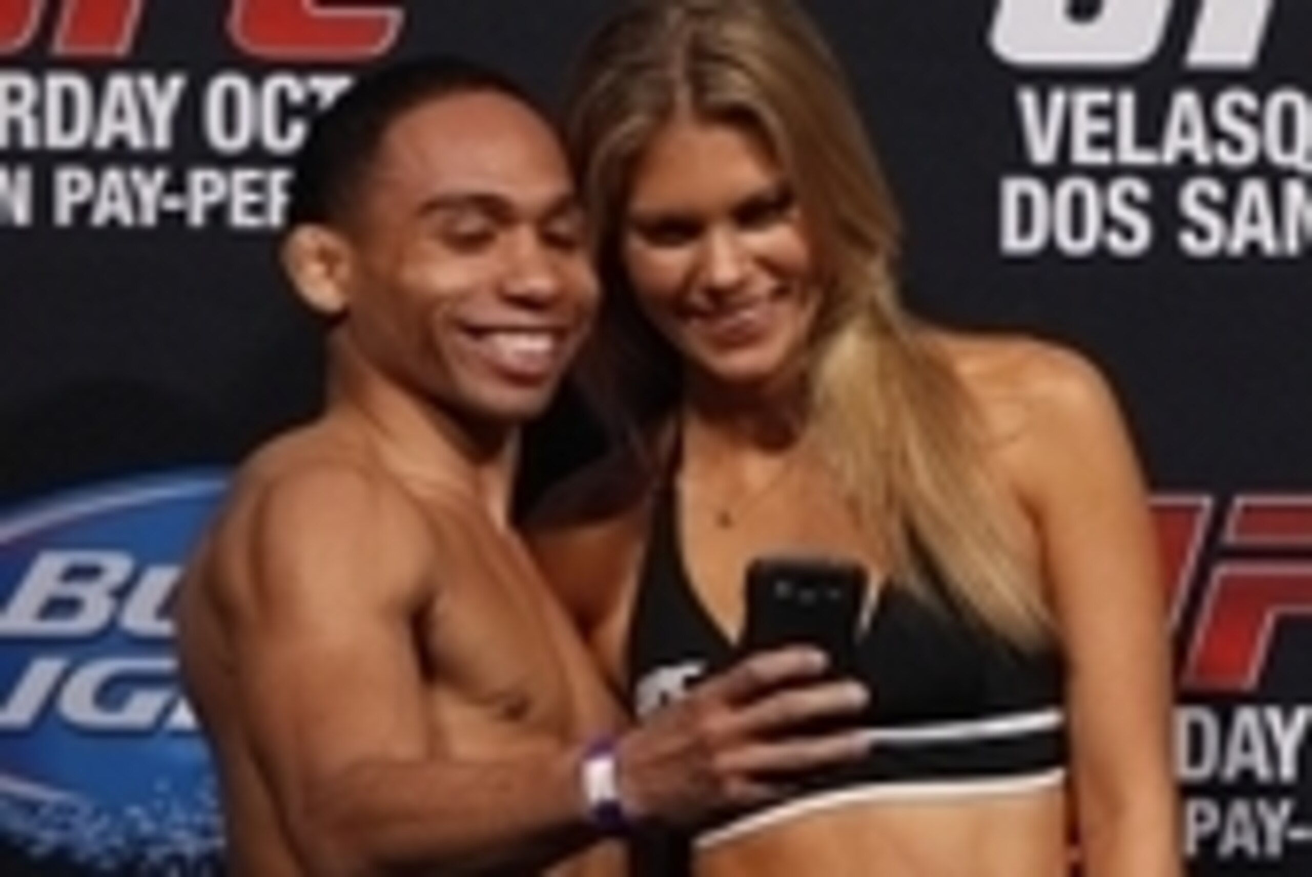 Oct 18, 2013; Houston, TX, USA; John Dodson takes a picture with octagon girl Chrissy Blair during the weigh-in for UFC 166 at Toyota Center. Mandatory Credit: Andrew Richardson-USA TODAY Sports