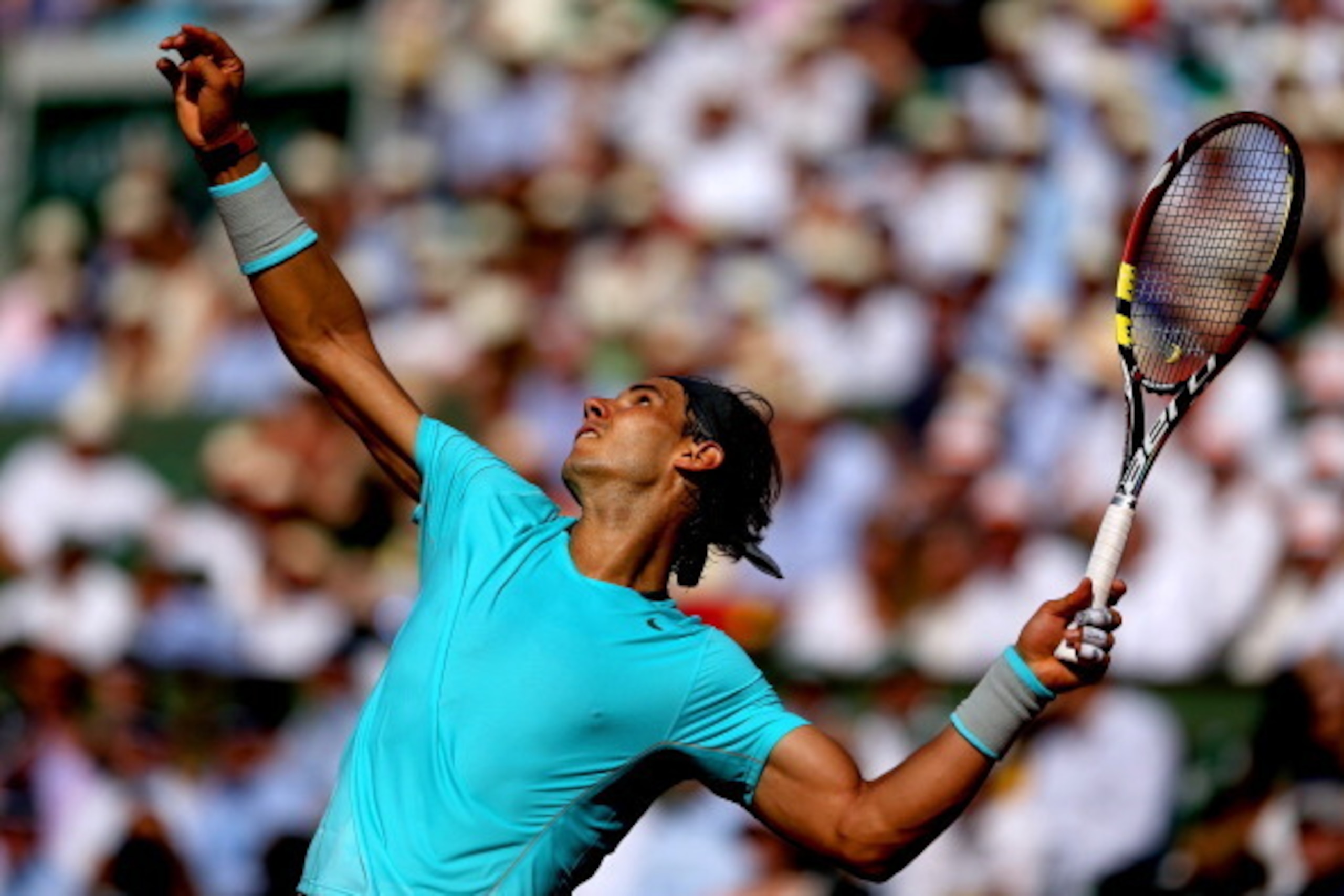 PARIS, FRANCE - JUNE 06:  Rafael Nadal of Spain serves during his men's singles match against Andy Murray of Great Britain on day thirteen of the French Open at Roland Garros on June 6, 2014 in Paris, France.  (Photo by Matthew Stockman/Getty Images)