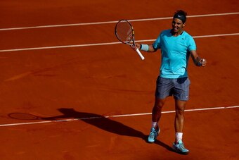PARIS, FRANCE - JUNE 06:  Rafael Nadal of Spain celebrates victory in his men's singles match against Andy Murray of Great Britain on day thirteen of the French Open at Roland Garros on June 6, 2014 in Paris, France.  (Photo by Dan Istitene/Getty Images)