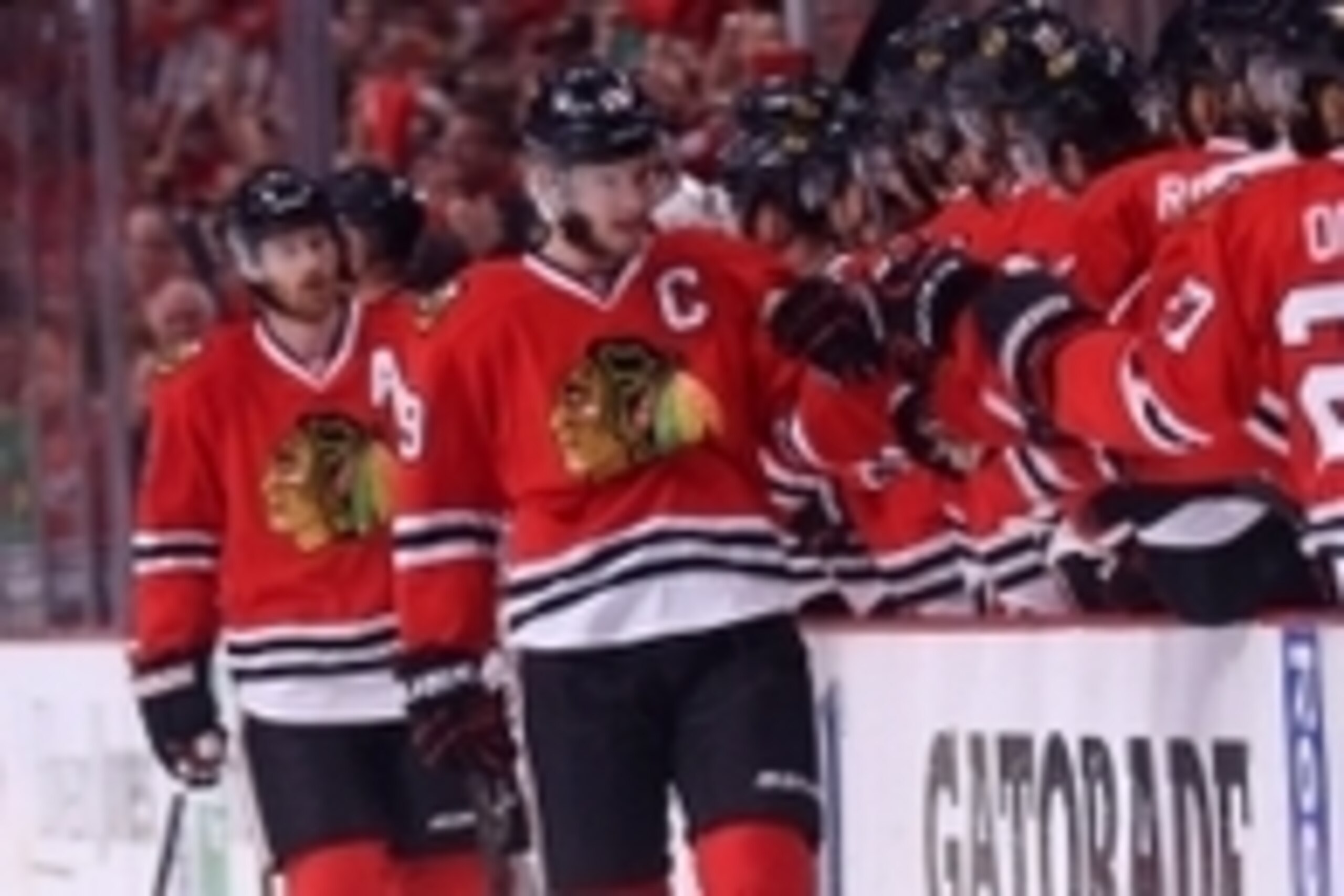 Jun 1, 2014; Chicago, IL, USA; Chicago Blackhawks center Jonathan Toews (19) is congratulated for scoring during the first period in game seven of the Western Conference Final of the 2014 Stanley Cup Playoffs against the Los Angeles Kings at the United Ce Jun 1, 2014; Chicago, IL, USA; Chicago Blackhawks center Jonathan Toews (19) is congratulated for scoring during the first period in game seven of the Western Conference Final of the 2014 Stanley Cup Playoffs against the Los Angeles Kings at the United Ce