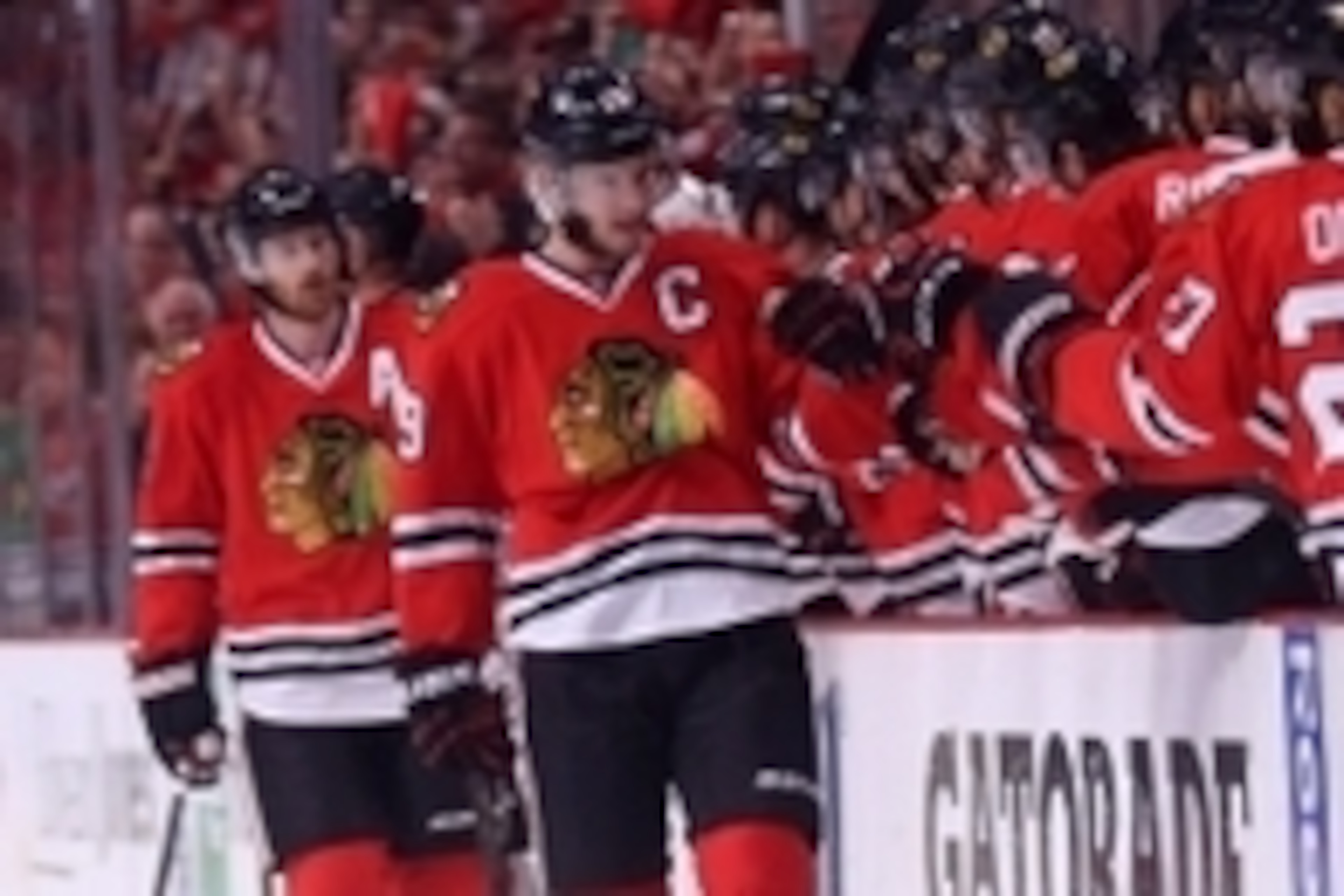 Jun 1, 2014; Chicago, IL, USA; Chicago Blackhawks center Jonathan Toews (19) is congratulated for scoring during the first period in game seven of the Western Conference Final of the 2014 Stanley Cup Playoffs against the Los Angeles Kings at the United Ce