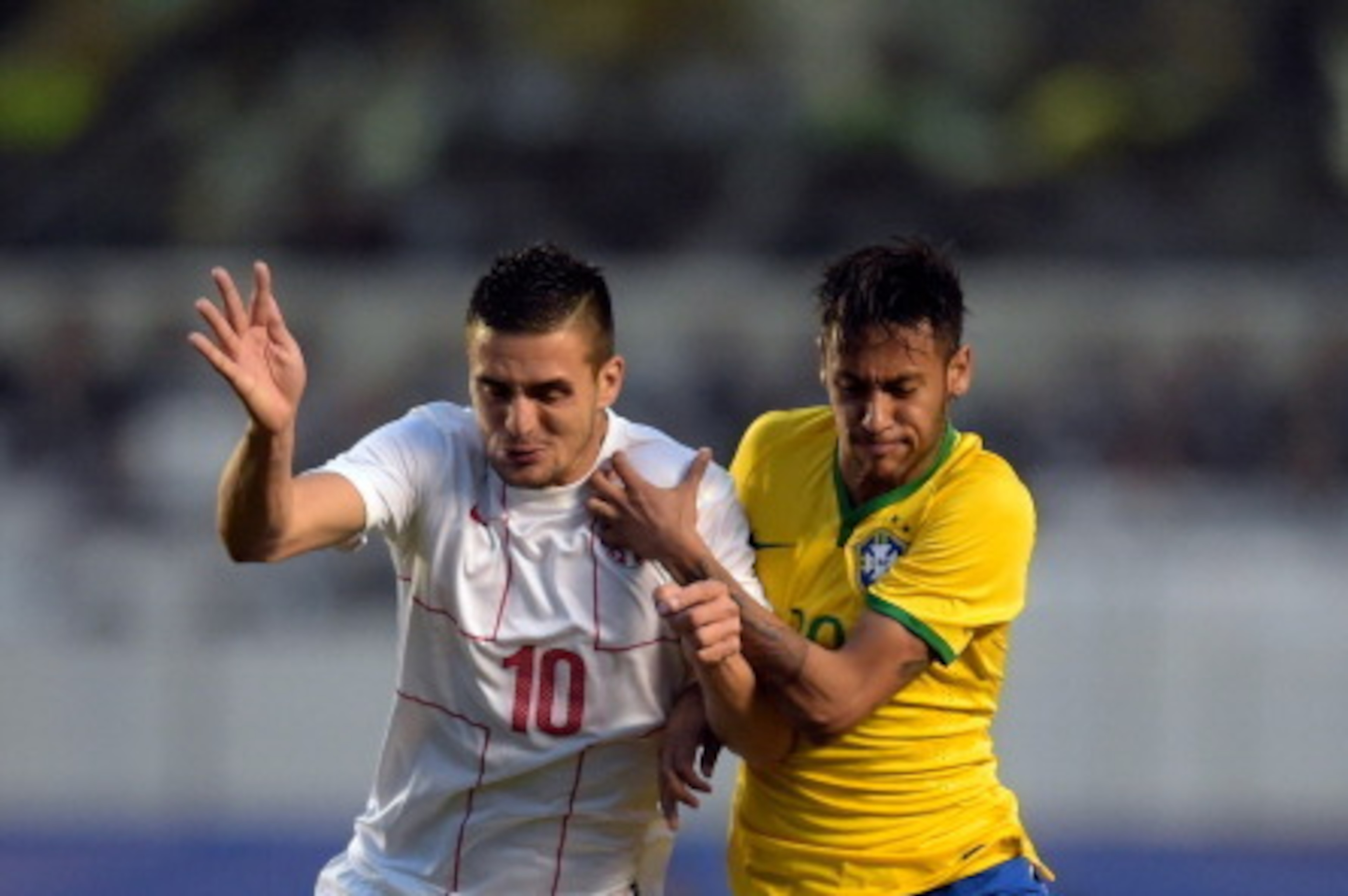SAO PAULO, BRAZIL - JUNE 06: Neymar (R) of Brazil and Tadic of Serbia compete for the ball during the International Friendly Match between Brazil and Serbia at Morumbi Stadium on June 06, 2014 in Sao Paulo, Brazil. (Photo by Buda Mendes/Getty Images) SAO PAULO, BRAZIL - JUNE 06: Neymar (R) of Brazil and Tadic of Serbia compete for the ball during the International Friendly Match between Brazil and Serbia at Morumbi Stadium on June 06, 2014 in Sao Paulo, Brazil. (Photo by Buda Mendes/Getty Images)