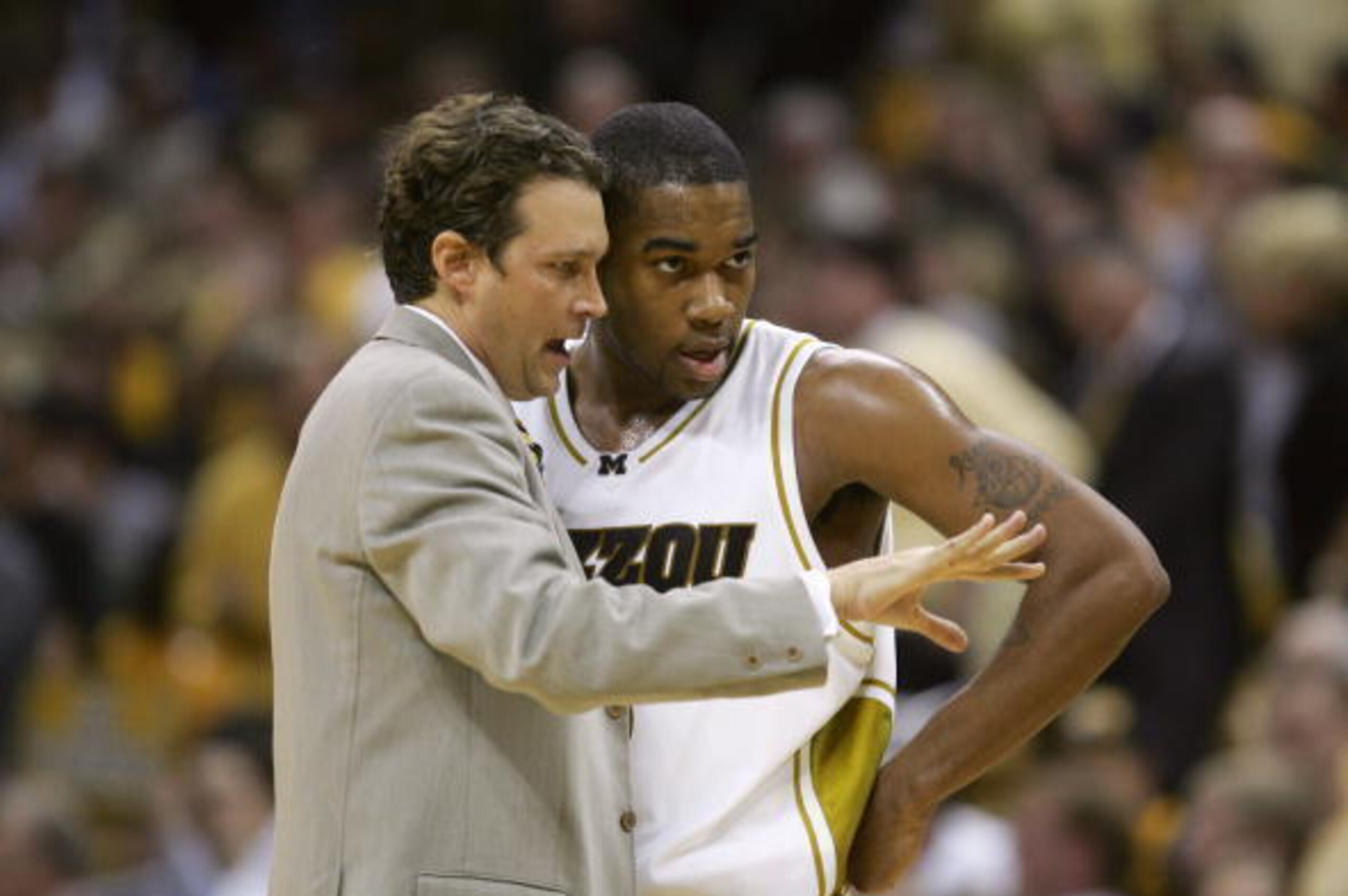 COLUMBIA, MO - JANUARY 16: Head coach Quin Snyder coaches Thomas Gardner #3 of the Missouri Tigers   during the game against the Kansas Jayhawks on January 16,2006 at Mizzou Arena in Columbia, Missouri. Missouri defeated Kansas 89-86 in overtime. (Photo b