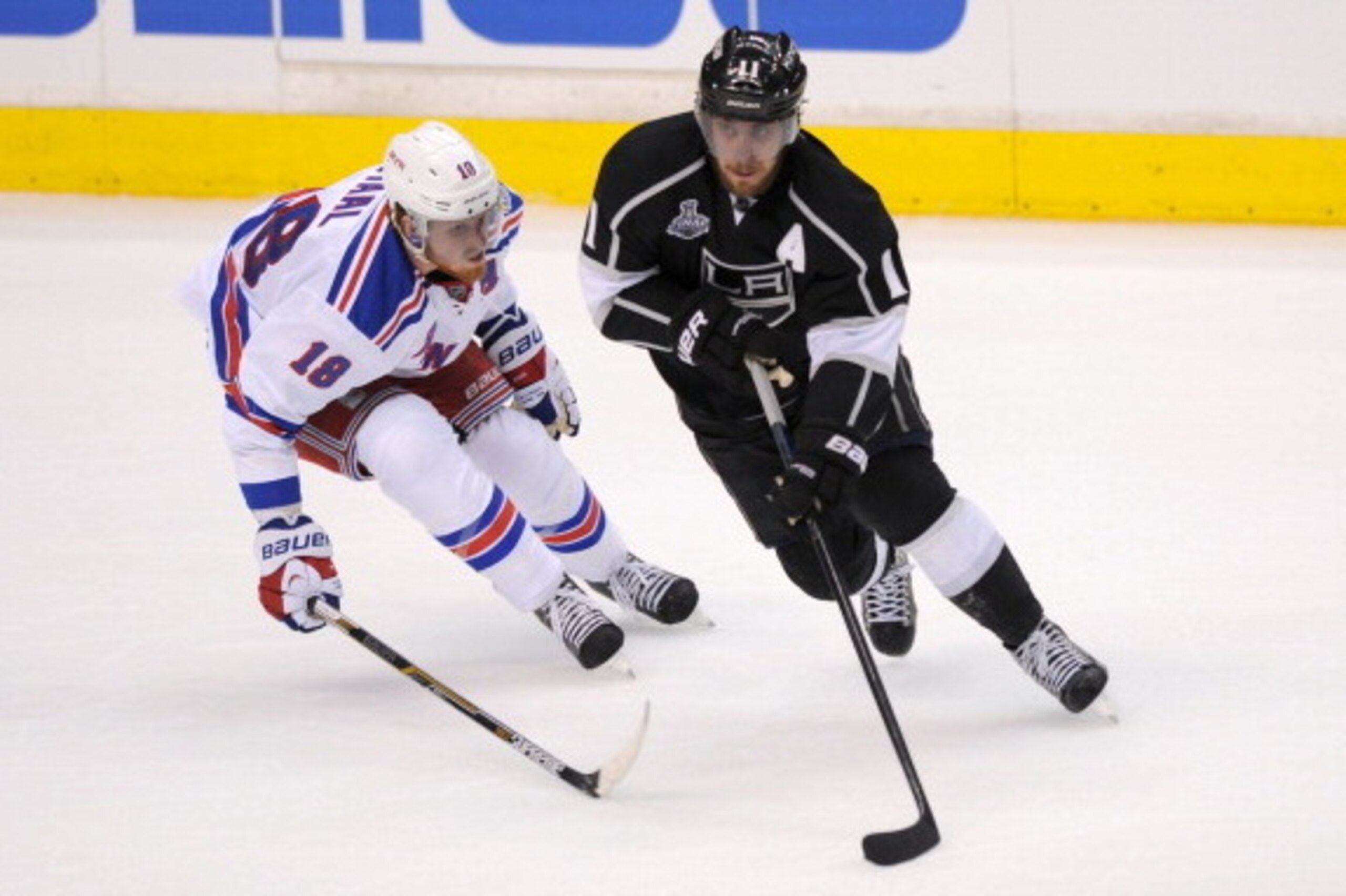 LOS ANGELES, CA - JUNE 4:  Anze Kopitar #11 of the Los Angeles Kings skates against Marc Staal #18 of the New York Rangers in Game One of the 2014 NHL Stanley Cup Final at Staples Center on June 4, 2014 in Los Angeles, California. (Photo by Juan Ocampo/NH