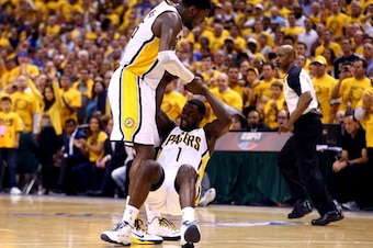 INDIANAPOLIS, IN - MAY 28:  Lance Stephenson #1 is helped up by Roy Hibbert #55 of the Indiana Pacers against the Miami Heat during Game Five of the Eastern Conference Finals of the 2014 NBA Playoffs at Bankers Life Fieldhouse on May 28, 2014 in Indianapo