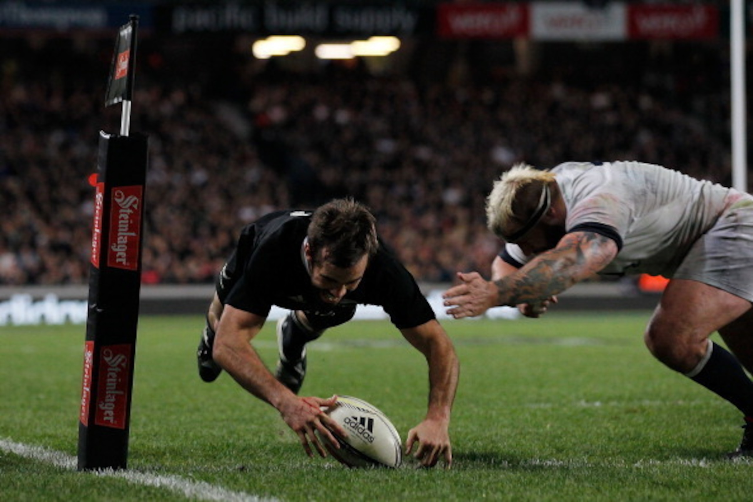 AUCKLAND, NEW ZEALAND - JUNE 07:  Conrad Smith of the All Blacks scores a try in the tackle of Joe Marler of England during the International Test Match between the New Zealand All Blacks and England at Eden Park on June 7, 2014 in Auckland, New Zealand. 