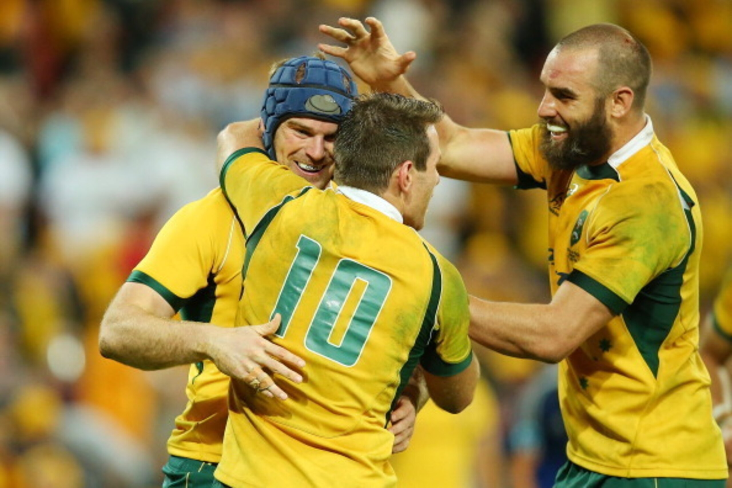 BRISBANE, AUSTRALIA - JUNE 07:  Pat McCabe of the Wallabies celebrates with Bernard Foley and Scott Fardy after scoring a try during the First International Test Match between the Australian Wallabies and France at Suncorp Stadium on June 7, 2014 in Brisb