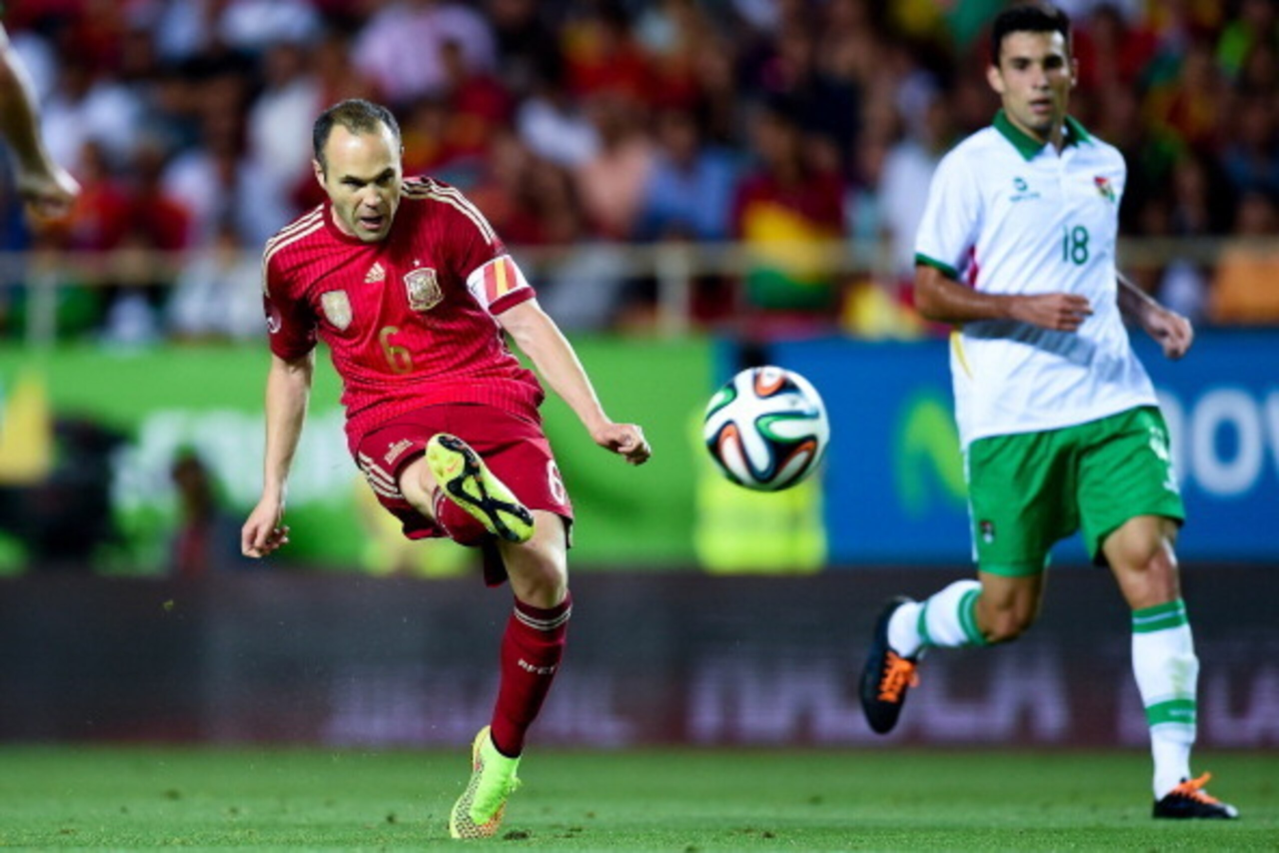 SEVILLE, SPAIN - MAY 30:  Andres Iniesta of Spain scores his team's second goal during an international friendly match between Spain and Bolivia at Estadio Ramon Sanchez Pizjuan on May 30, 2014 in Seville, Spain.  (Photo by David Ramos/Getty Images)
