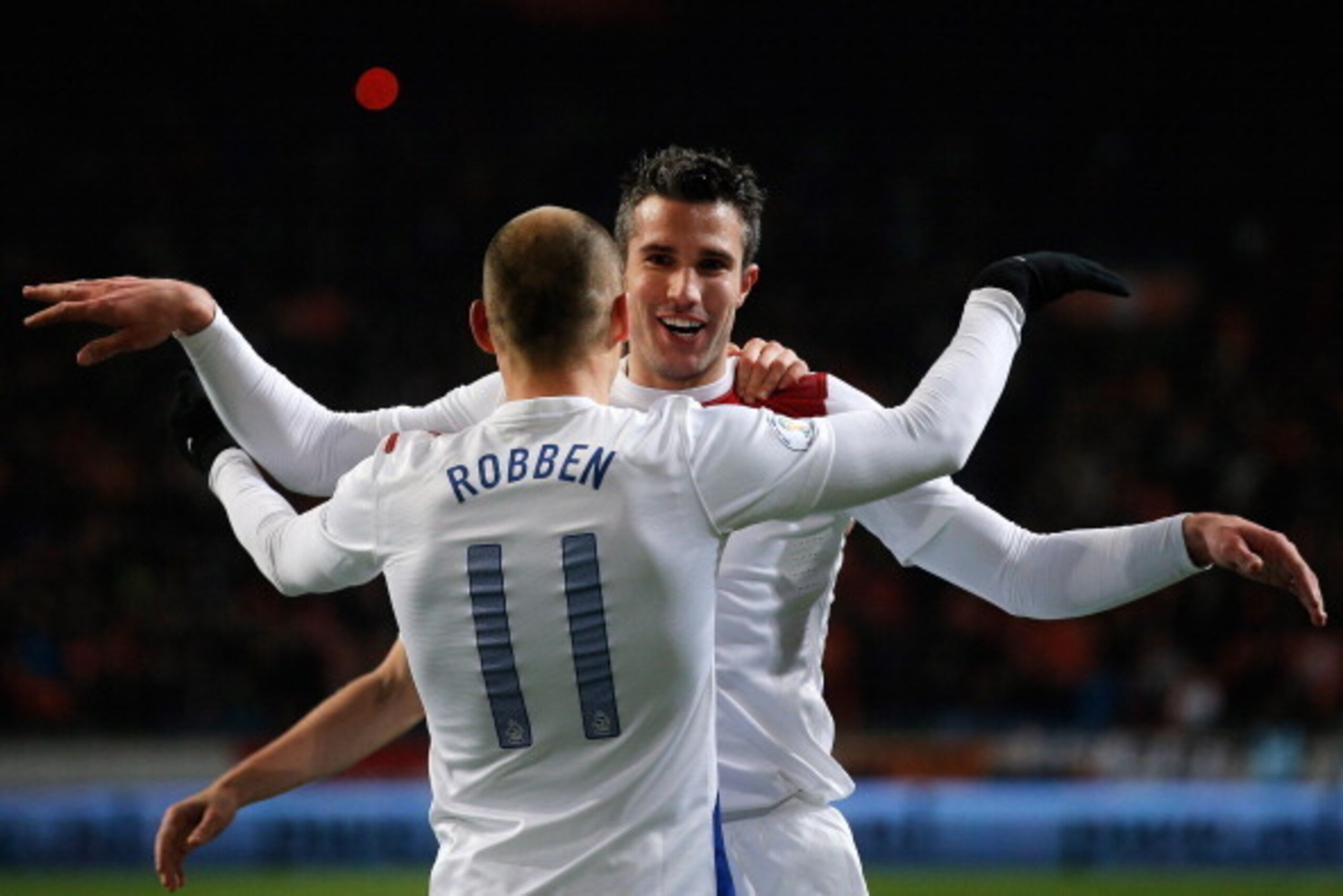 AMSTERDAM, NETHERLANDS - MARCH 26:  Robin Van Persie (#9) of Netherlands celebrates with team mate Arjen Robben after scoring the second goal of the game during the the Group 4 FIFA 2014 World Cup Qualifier match between Netherlands and Romania at Amsterd