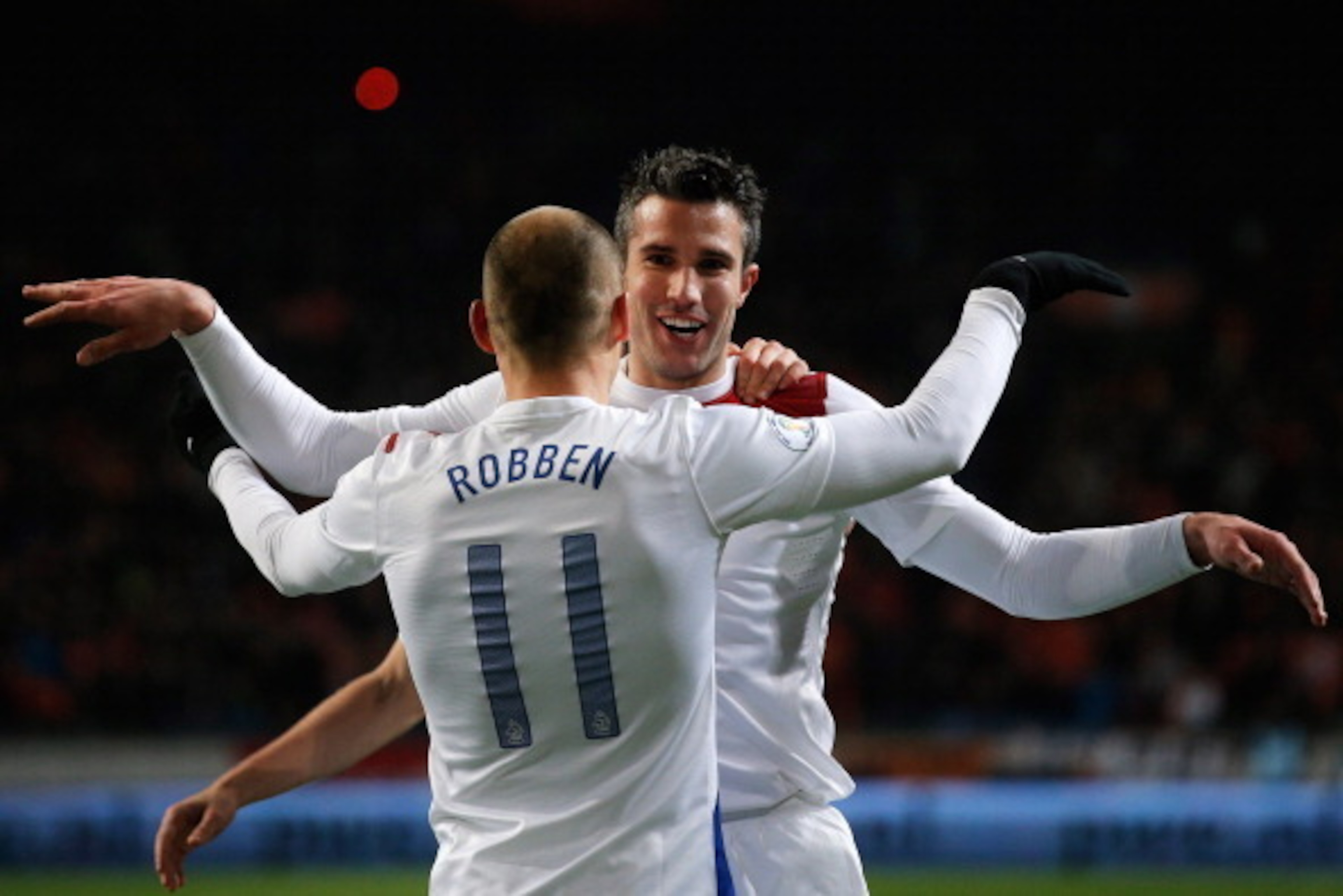 AMSTERDAM, NETHERLANDS - MARCH 26:  Robin Van Persie (#9) of Netherlands celebrates with team mate Arjen Robben after scoring the second goal of the game during the the Group 4 FIFA 2014 World Cup Qualifier match between Netherlands and Romania at Amsterd