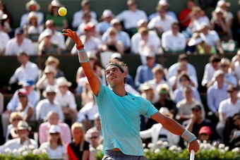 PARIS, FRANCE - JUNE 06:  Rafael Nadal of Spain serves during his men's singles match against Andy Murray of Great Britain on day thirteen of the French Open at Roland Garros on June 6, 2014 in Paris, France.  (Photo by Matthew Stockman/Getty Images)