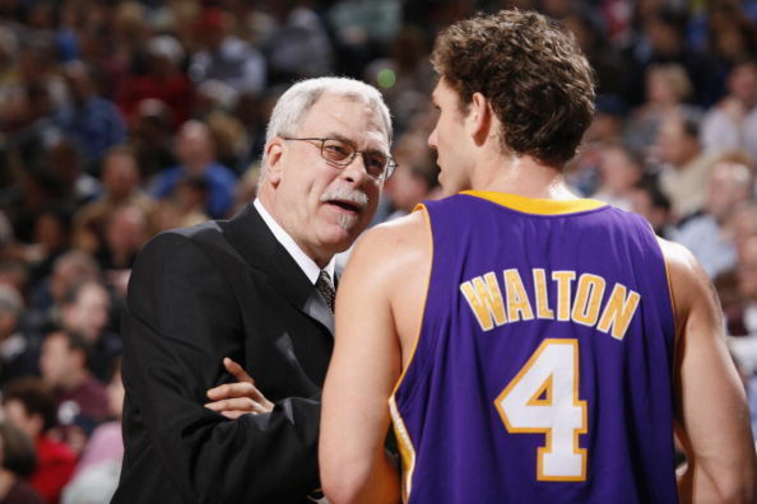 DALLAS - FEBRUARY 7:  Head coach Phil Jackson of the Los Angeles Lakers talks ot his teammate Luke Walton #4 during the game against the Dallas Mavericks at American Airlines Arena on February 7, 2006 in Dallas, Texas.  The Mavericks won 102-87.  NOTE TO 