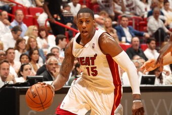 MIAMI, FL - MAY 14: Mario Chalmers #15 of the Miami Heat drives against the Brooklyn Nets in Game Five of the Eastern Conference Semifinals during the 2014 NBA playoffs at American Airlines Arena in Miami, Florida on May 14, 2014.  NOTE TO USER: User expr
