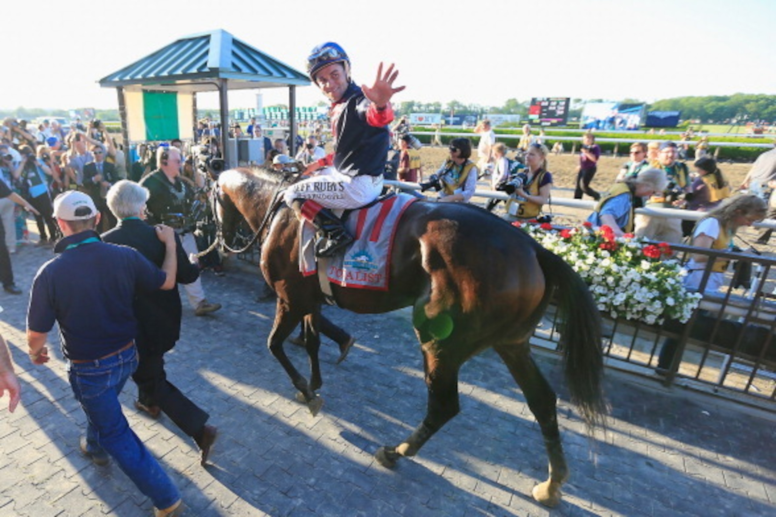 ELMONT, NY - JUNE 07:  Tonalist #11, ridden by Joel Rosario, celebrates in the winner's circle after winning the 146th running of the Belmont Stakes at Belmont Park on June 7, 2014 in Elmont, New York.  (Photo by Rob Carr/Getty Images)