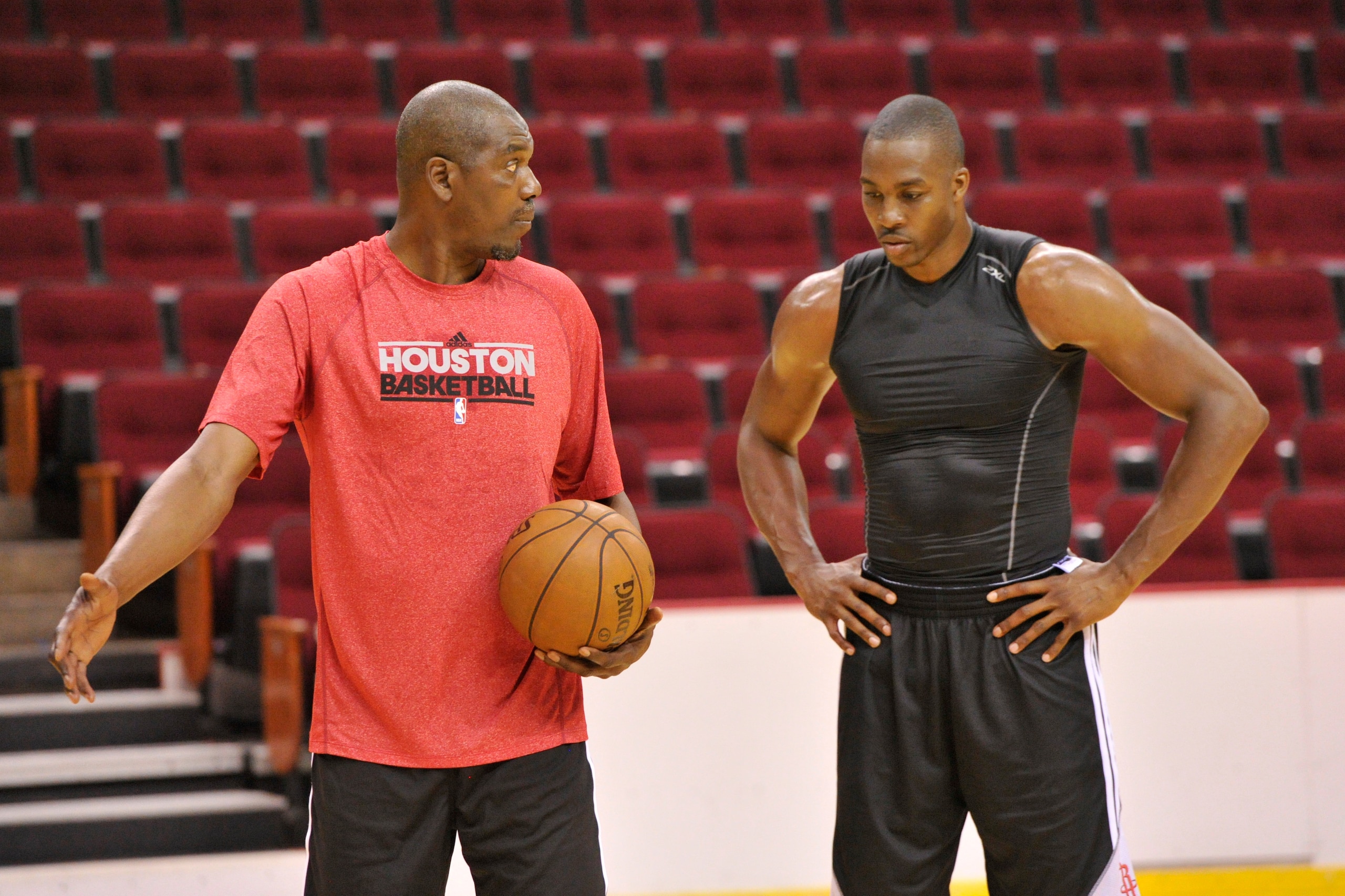 HOUSTON, TX - JULY 13, 2013: Legend Hakeem Olajuwon works out with Dwight Howard of the Houston Rockets on August 13, 2013 at The Toyota Center Houston, Texas.  NOTE TO USER: User expressly acknowledges and agrees that, by downloading and or using this ph