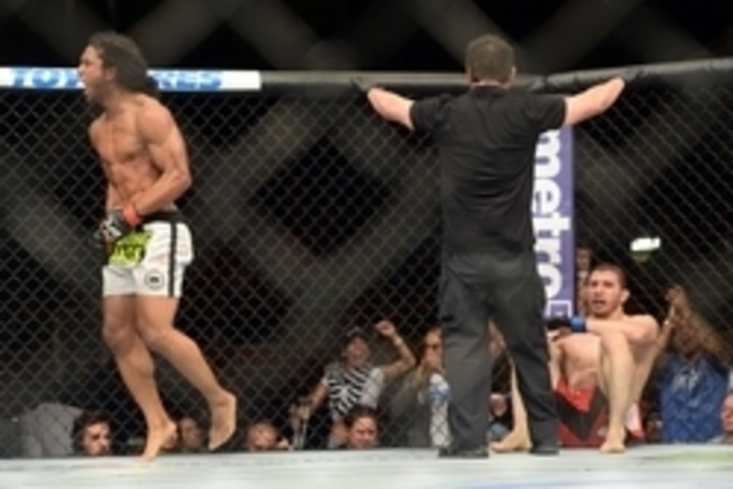 Jun 7, 2014; Albuquerque, NM, USA; Benson Henderson (red) celebrates his victory over Rustam Khabilov (blue) after their lightweight bout during UFC Fight Night 42 at Tingley Coliseum. Henderson won via fourth round submission. Mandatory Credit: Joe Campo