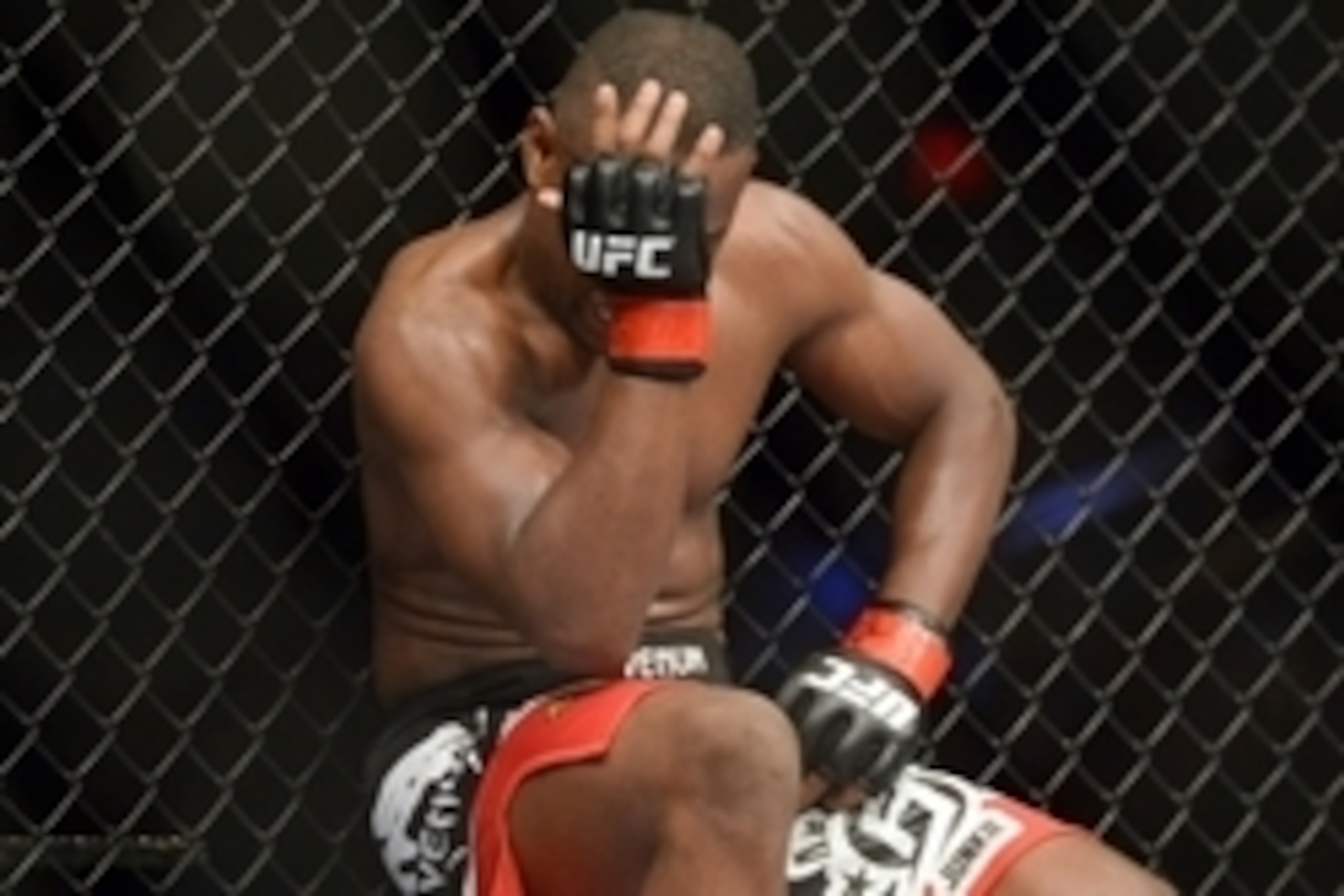 Jun 7, 2014; Albuquerque, NM, USA; Yves Edwards (red) reacts after catching a thumb to the tie against Piotr Hallmann (blue) during their lightweight bout during UFC Fight Night 42 at Tingley Coliseum. Hallmann won via third round submission. Mandatory Cr