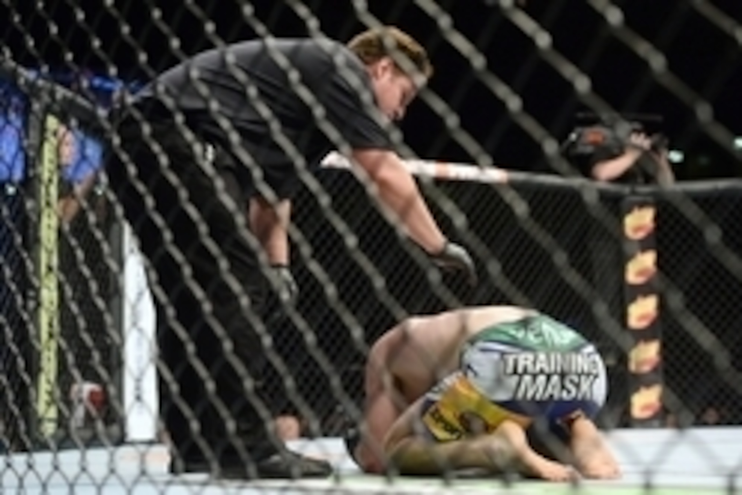 Jun 7, 2014; Albuquerque, NM, USA; Jake Lindsey (blue) is tended to after his lightweight bout against Jon Tuck (red) during UFC Fight Night 42 at Tingley Coliseum. Tuck won via second round submission. Mandatory Credit: Joe Camporeale-USA TODAY Sports