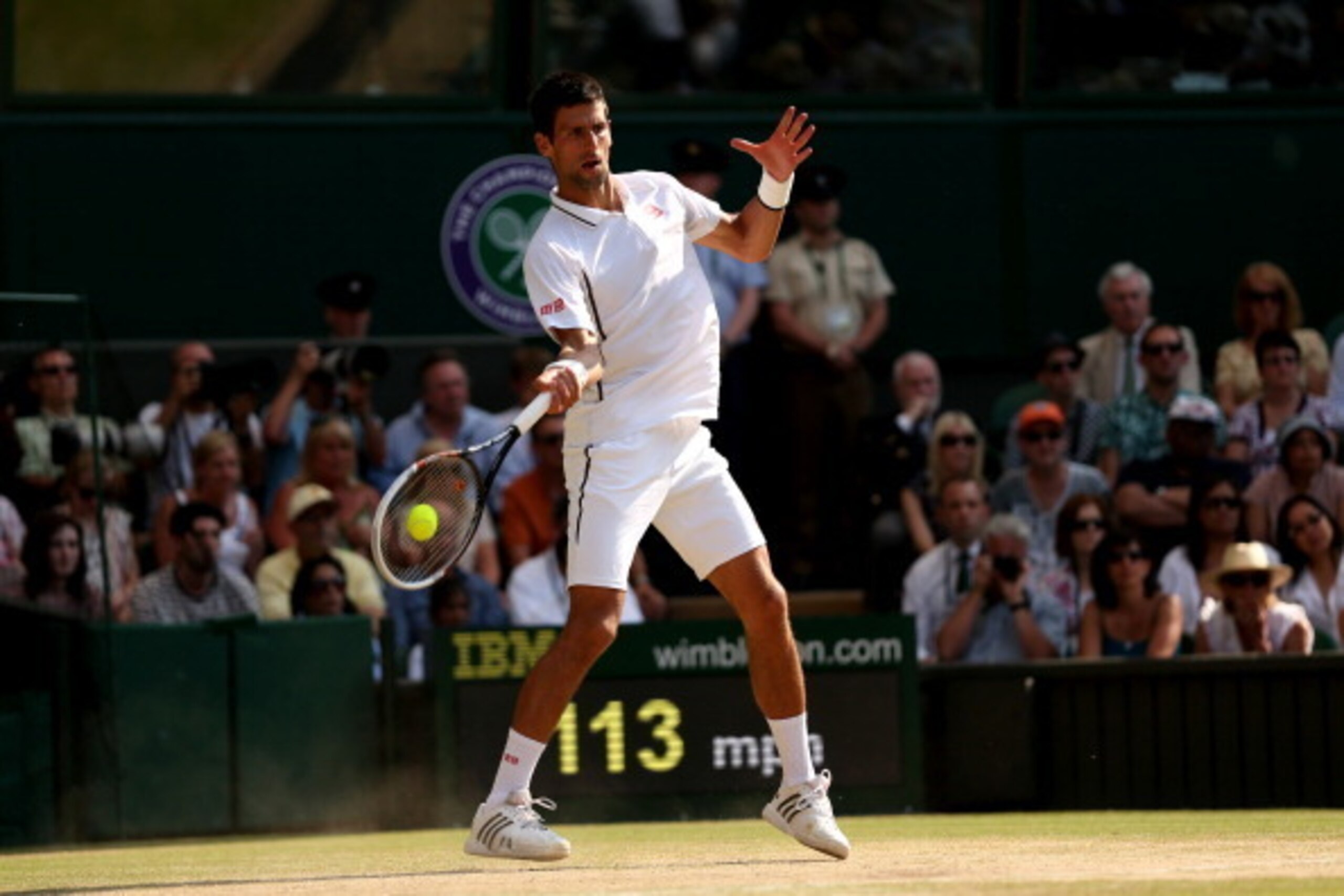 LONDON, ENGLAND - JULY 07:  Novak Djokovic of Serbia hits a forehand during the Gentlemen's Singles Final match against Andy Murray of Great Britain on day thirteen of the Wimbledon Lawn Tennis Championships at the All England Lawn Tennis and Croquet Club