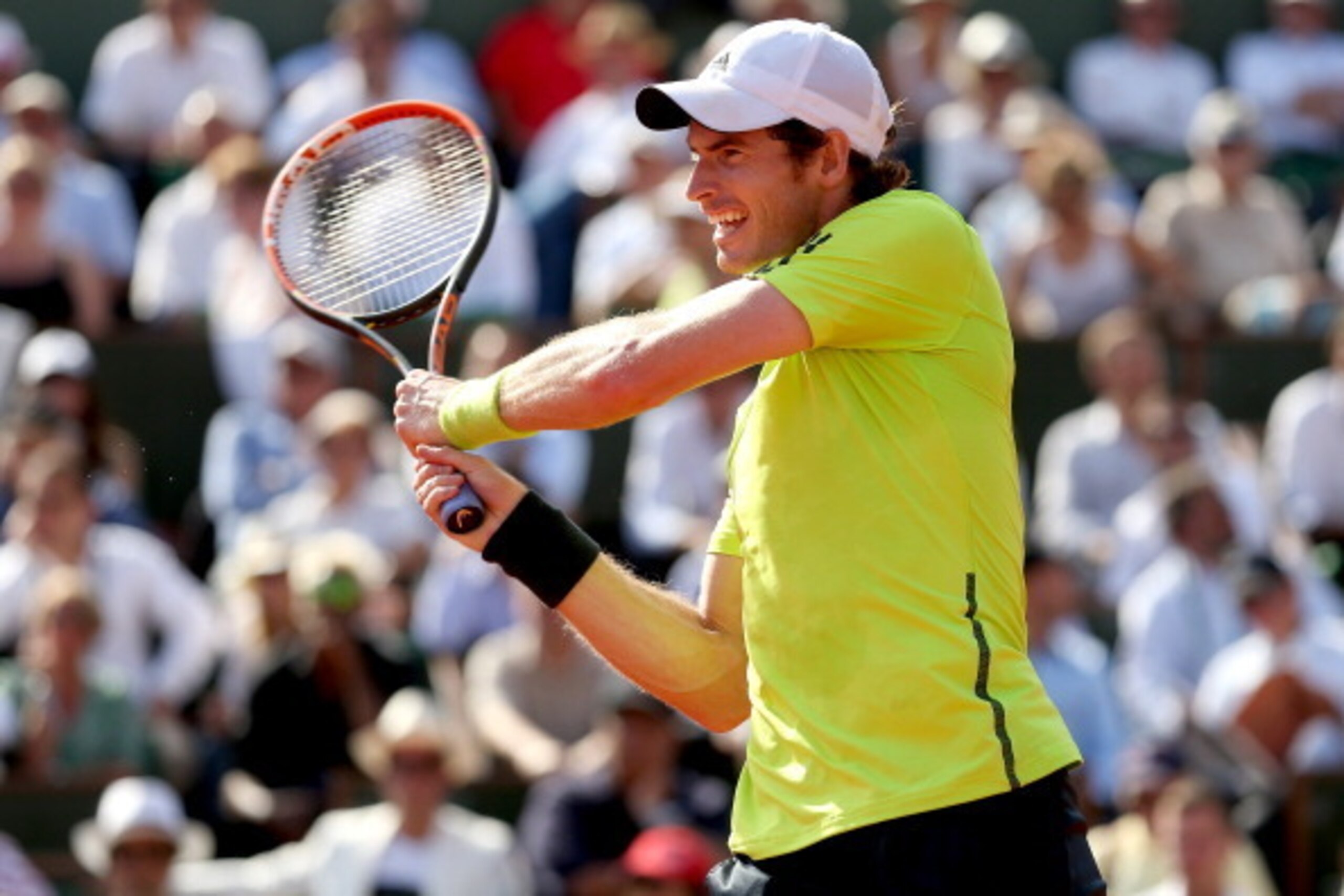 PARIS, FRANCE - JUNE 06:  Andy Murray of Great Britain returns a shot during his men's singles match against Rafael Nadal of Spain on day thirteen of the French Open at Roland Garros on June 6, 2014 in Paris, France.  (Photo by Matthew Stockman/Getty Imag