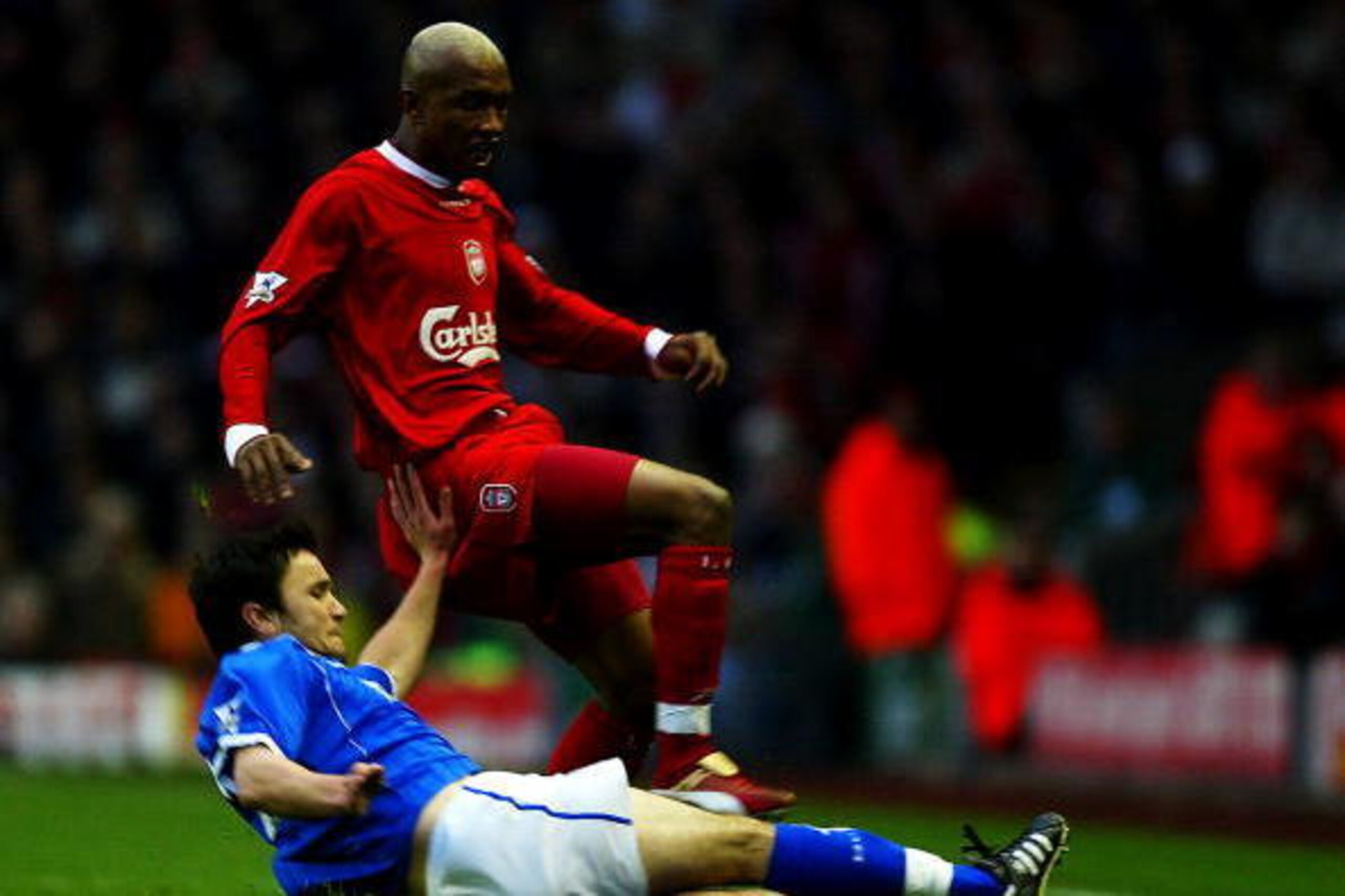 LIVERPOOL, ENGLAND - NOVEMBER 30: El Hadji Diouf of Liverpool clashes with Damien Johnson of Birmingham during the FA Barclaycard Premiership match between Liverpool and Birmingham City at Anfield on Novermber 30, 2003 in Liverpool, England.  (Photo by Ga