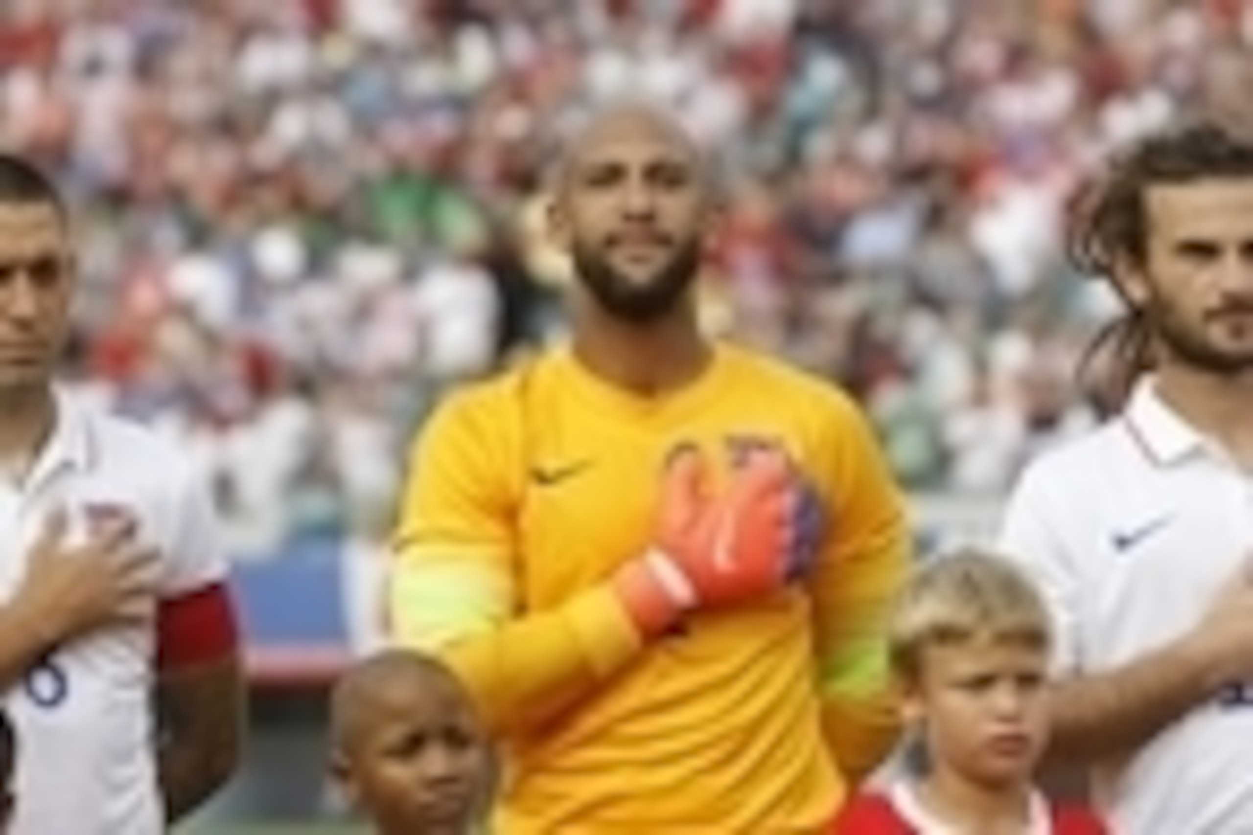 Jun 7, 2014; Jacksonville, FL, USA; United States forward Clint Dempsey (8), goalkeeper Tim Howard (1) and midfielder Kyle Beckerman (15) during thre national anthem during the first half at EverBank Field. Mandatory Credit: Kim Klement-USA TODAY Sports