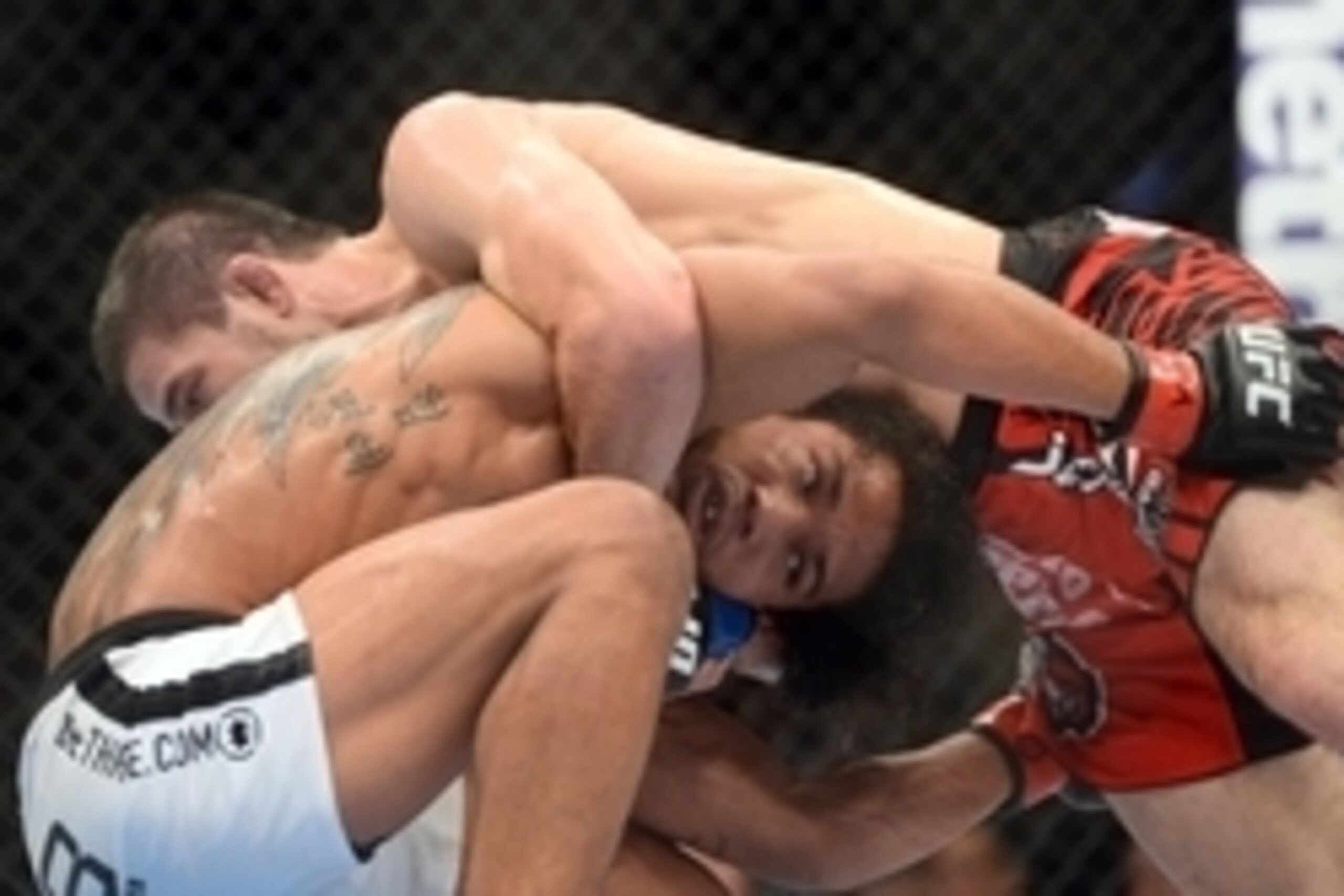 Jun 7, 2014; Albuquerque, NM, USA; Benson Henderson (red) and Rustam Khabilov (blue) fight during their lightweight bout during UFC Fight Night 42 at Tingley Coliseum. Henderson won via fourth round submission. Mandatory Credit: Joe Camporeale-USA TODAY S