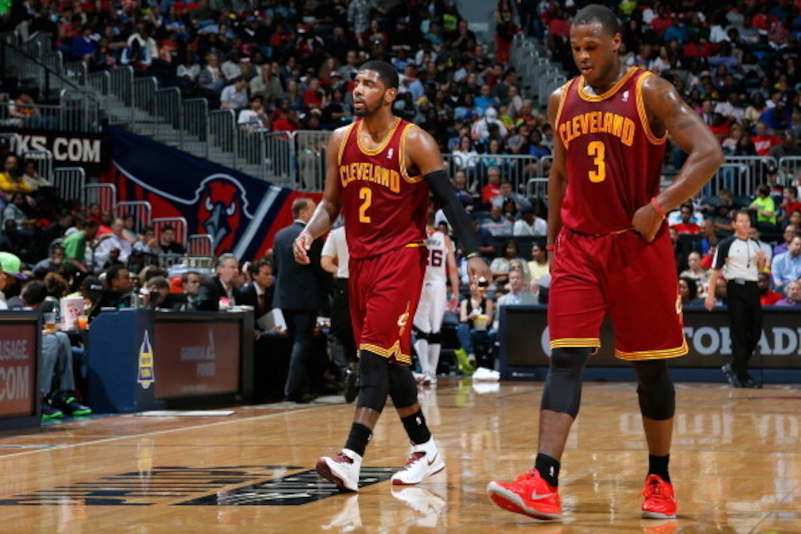 ATLANTA, GA - APRIL 04:  Kyrie Irving #2 and Dion Waiters #3 of the Cleveland Cavaliers walk off the court between free throws in their 117-98 loss to the Atlanta Hawks at Philips Arena on April 4, 2014 in Atlanta, Georgia.  NOTE TO USER: User expressly a