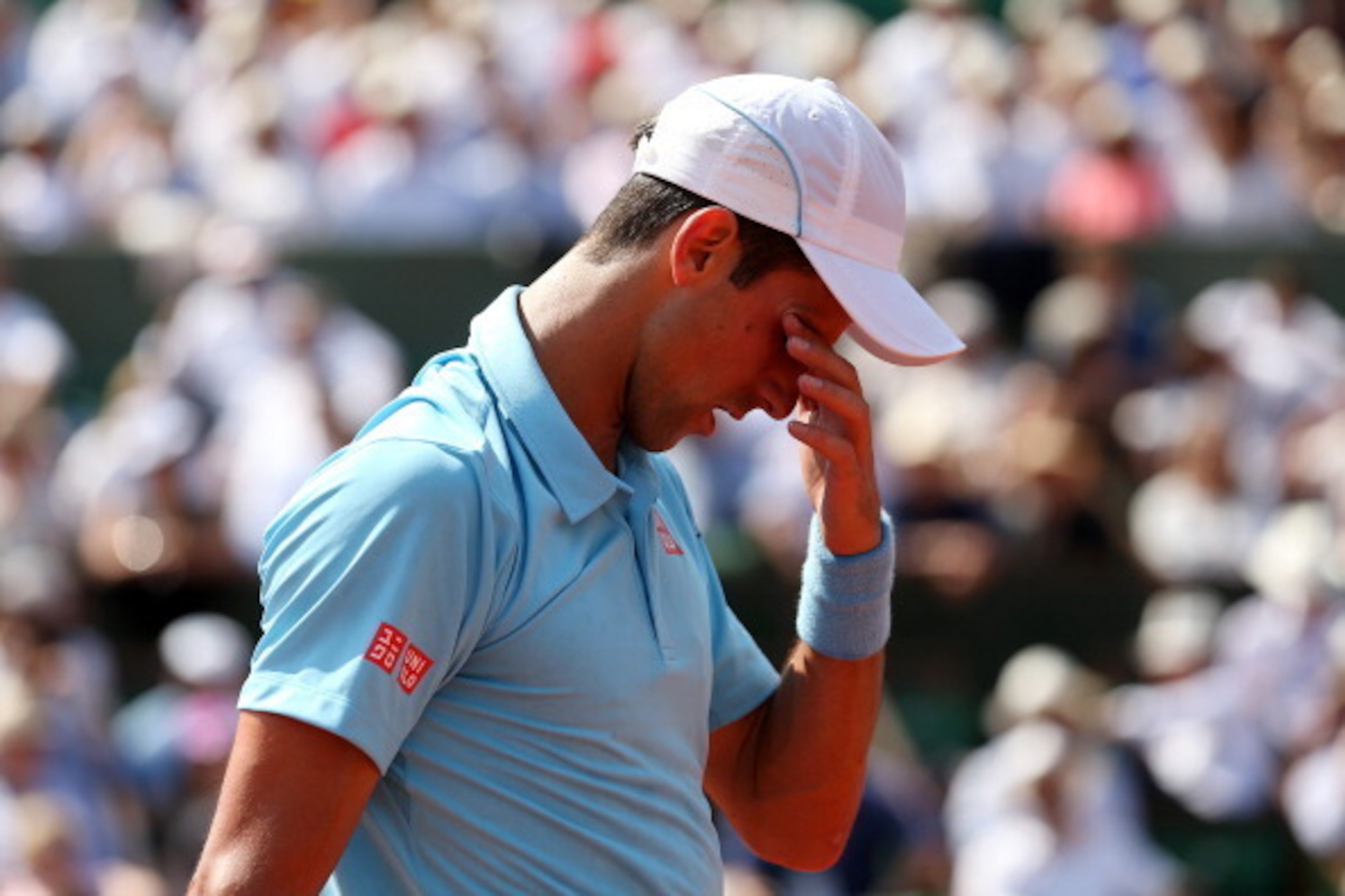 PARIS, FRANCE - JUNE 08:  Novak Djokovic of Serbia reacts during his men's singles final match against Rafael Nadal of Spain on day fifteen of the French Open at Roland Garros on June 8, 2014 in Paris, France.  (Photo by Matthew Stockman/Getty Images)