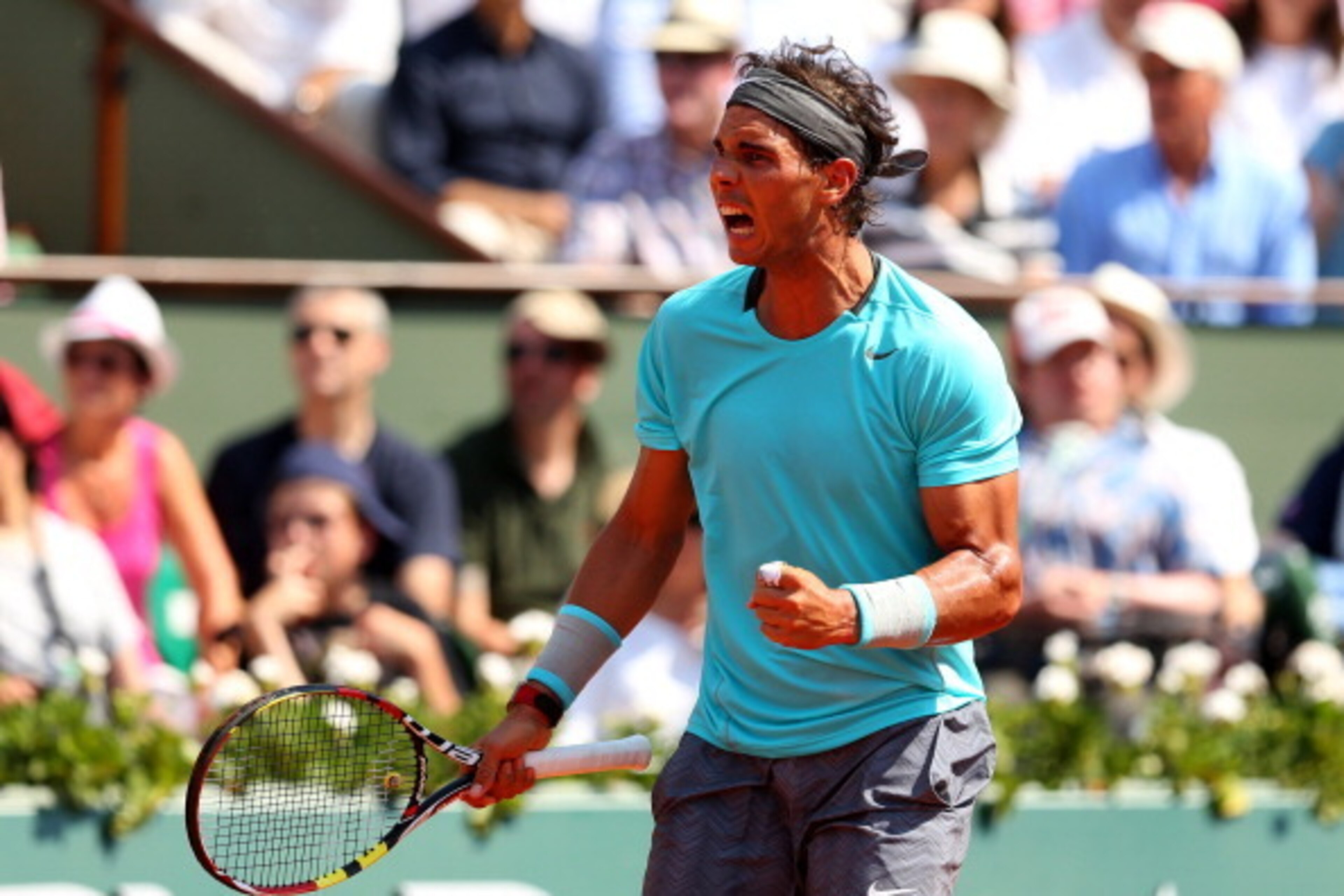 PARIS, FRANCE - JUNE 08: Rafael Nadal of Spain celebrates a point during his men's singles final match against Novak Djokovic of Serbia on day fifteen of the French Open at Roland Garros on June 8, 2014 in Paris, France. (Photo by Clive Brunskill/Getty PARIS, FRANCE - JUNE 08: Rafael Nadal of Spain celebrates a point during his men's singles final match against Novak Djokovic of Serbia on day fifteen of the French Open at Roland Garros on June 8, 2014 in Paris, France. (Photo by Clive Brunskill/Getty