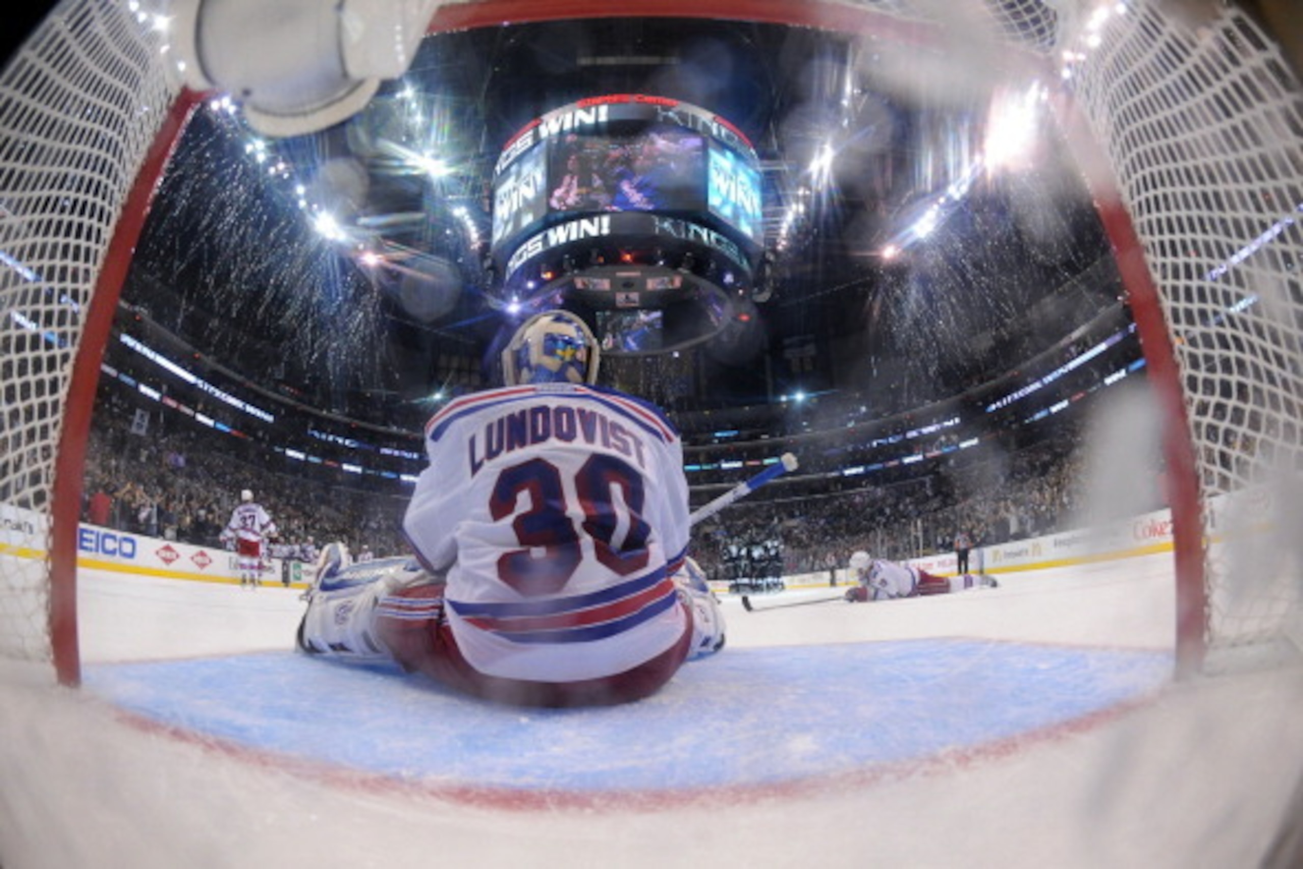 LOS ANGELES, CA - JUNE 7:  Henrik Lundqvist #30 of the New York Rangers sits in the crease after giving up the game-winning goal to Dustin Brown #23 of the Los Angeles Kings in the second overtime period of Game Two of the Stanley Cup Final during the 201