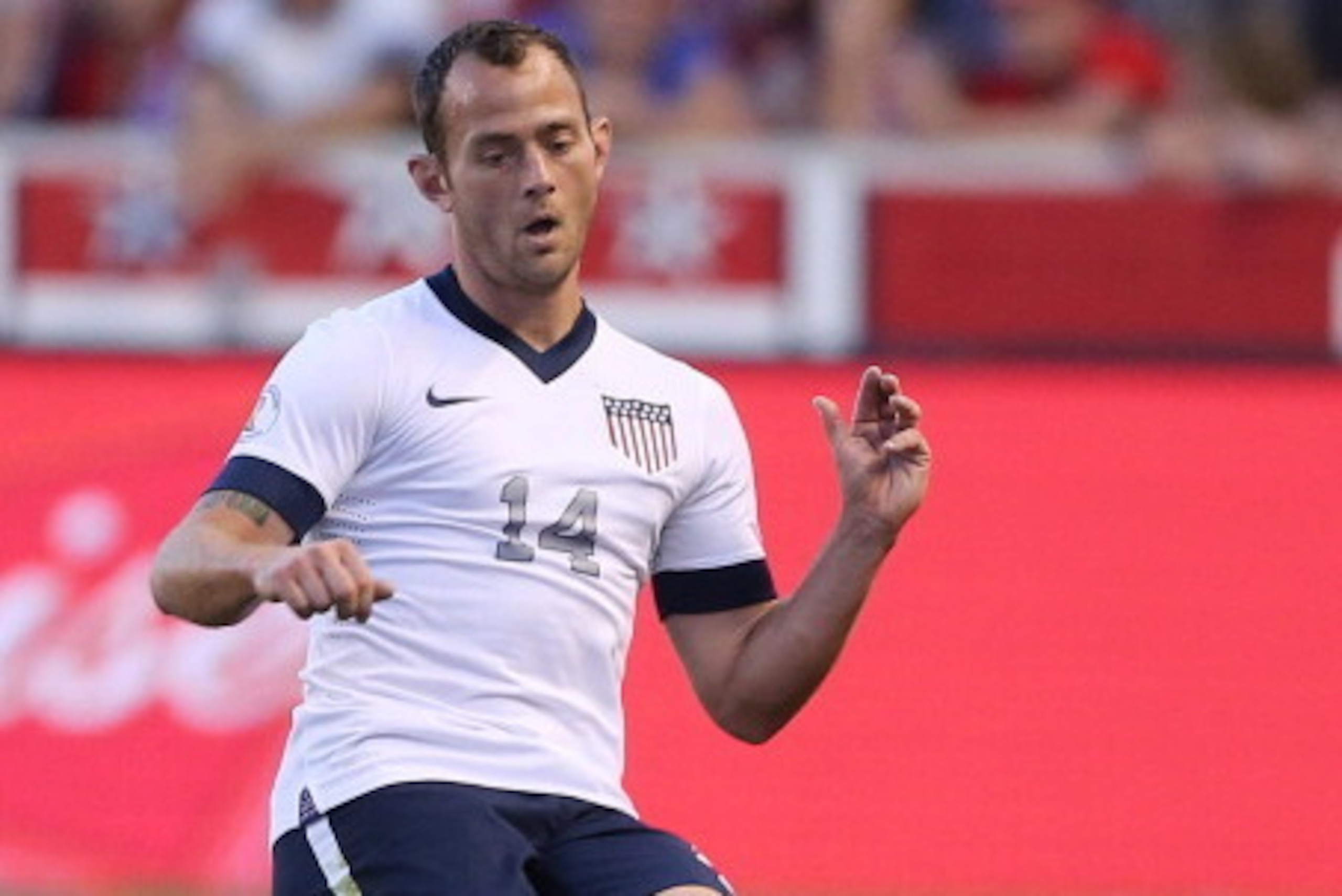 SANDY, UT - JUNE 18: Brad Davis #14 of the United States kicks the ball down field during a game against Honduras during the second half of an World Cup Qualifying March June 18, 2013 at Rio Tinto Stadium in Sandy, Utah. The USA beat Honduras 1-0. (Photo 