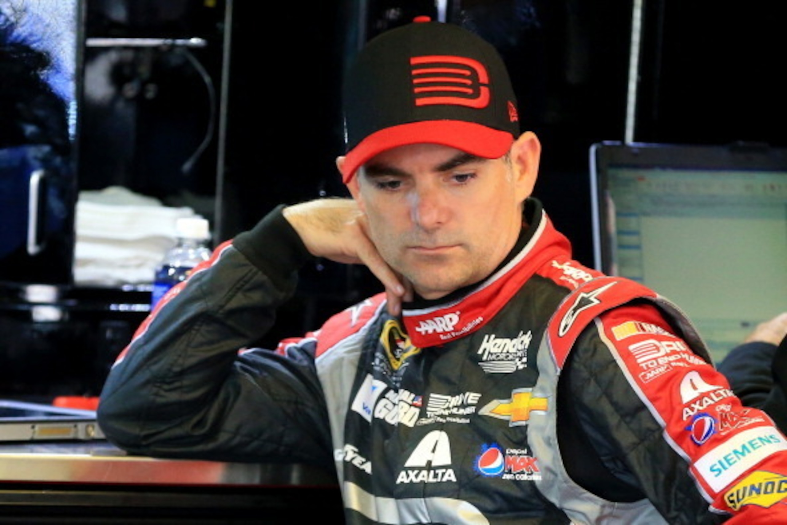 LONG POND, PA - JUNE 07:  Jeff Gordon, driver of the #24 Drive To End Hunger Chevrolet, looks on in the garage area during practice for the NASCAR Sprint Cup Series Pocono 400 at Pocono Raceway on June 7, 2014 in Long Pond, Pennsylvania.  (Photo by Daniel