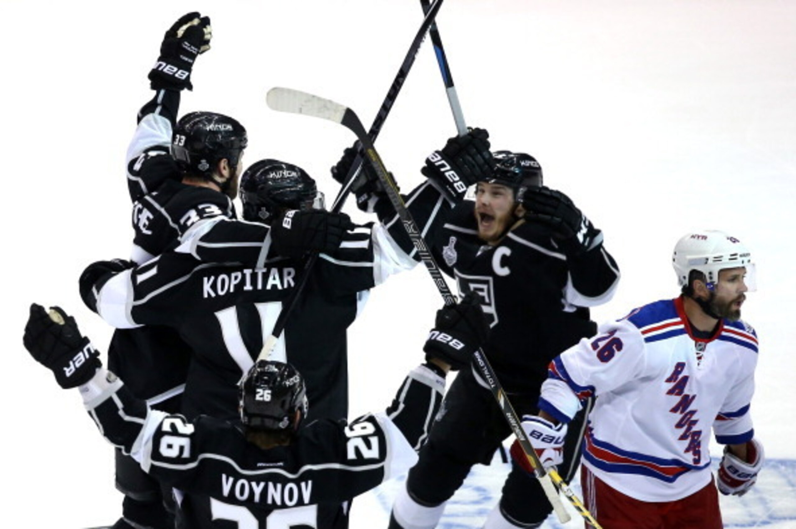 LOS ANGELES, CA - JUNE 07: Dustin Brown #23 of the Los Angeles Kings celebrates his double overtime game winner as the Kings defeat the New York Rangers 5-4 during Game Two of the 2014 NHL Stanley Cup Final at the Staples Center on June 7, 2014 in Los An LOS ANGELES, CA - JUNE 07: Dustin Brown #23 of the Los Angeles Kings celebrates his double overtime game winner as the Kings defeat the New York Rangers 5-4 during Game Two of the 2014 NHL Stanley Cup Final at the Staples Center on June 7, 2014 in Los An