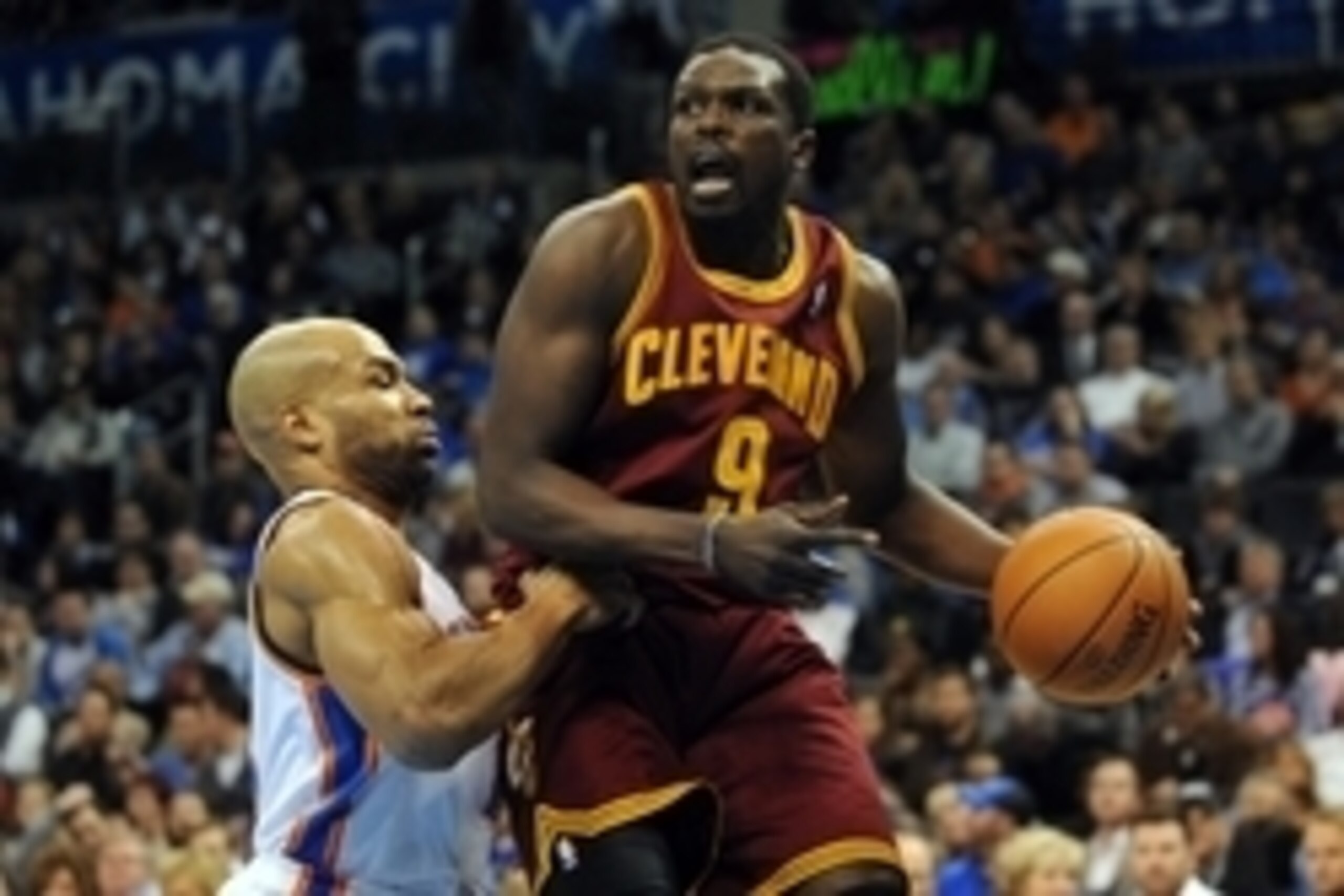 Feb 26, 2014; Oklahoma City, OK, USA; Cleveland Cavaliers small forward Luol Deng (9) handles the ball against Oklahoma City Thunder point guard Derek Fisher (6) during the second quarter at Chesapeake Energy Arena. Mandatory Credit: Mark D. Smith-USA TOD