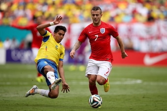 MIAMI GARDENS, FL - JUNE 04:  Jack Wilshere of England evades the tackle during the International friendly match between England and Ecuador at Sun Life Stadium on June 4, 2014 in Miami Gardens, Florida.  (Photo by Richard Heathcote/Getty Images)