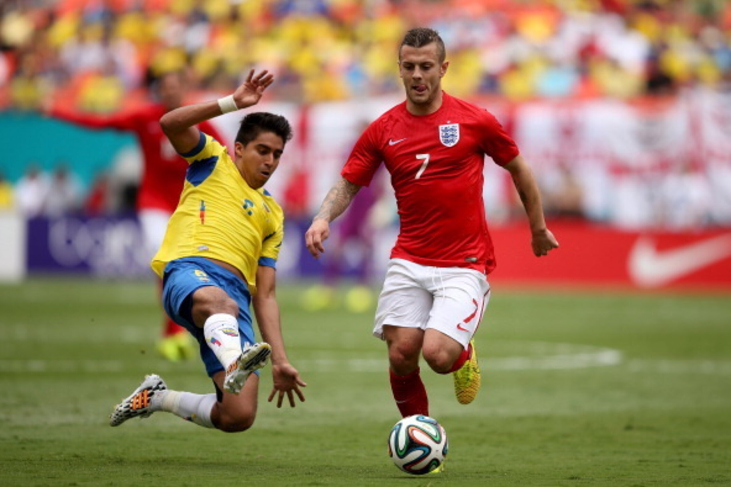 MIAMI GARDENS, FL - JUNE 04:  Jack Wilshere of England evades the tackle during the International friendly match between England and Ecuador at Sun Life Stadium on June 4, 2014 in Miami Gardens, Florida.  (Photo by Richard Heathcote/Getty Images)
