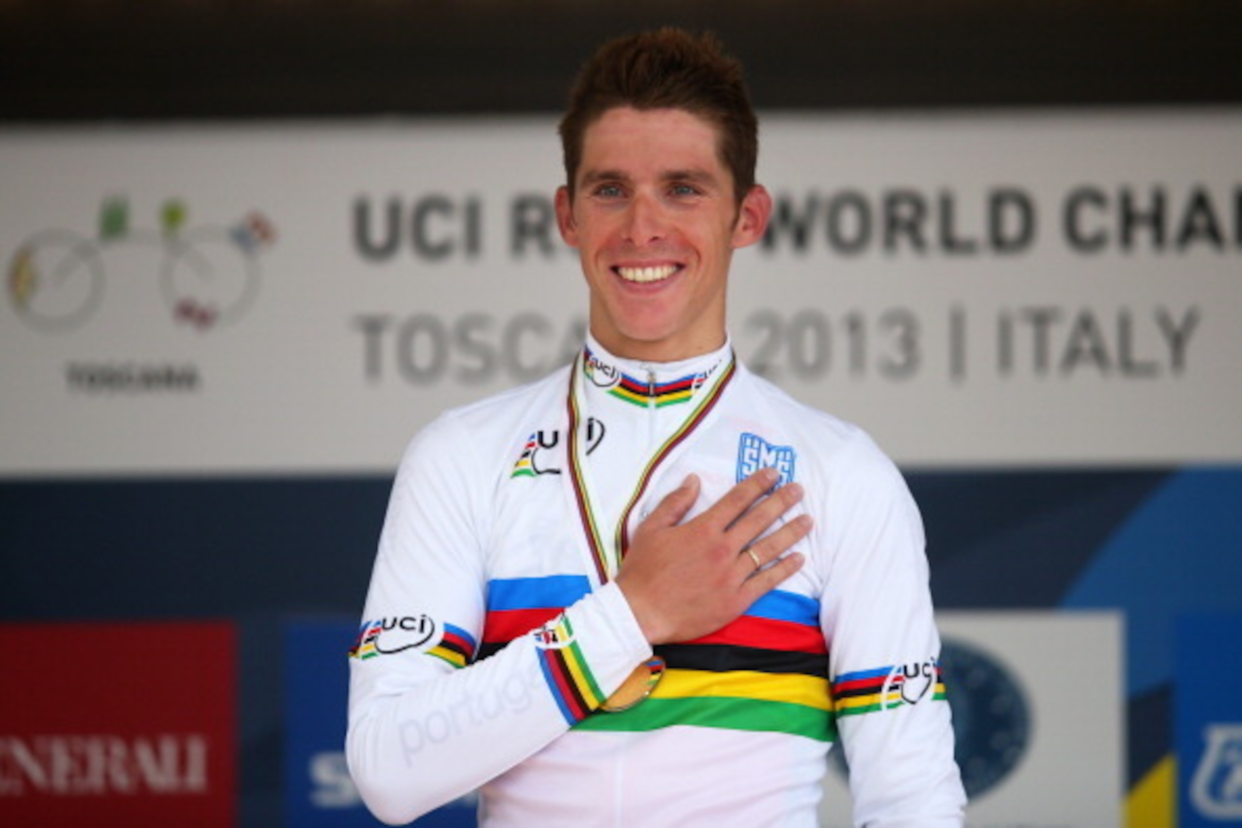 FLORENCE, ITALY - SEPTEMBER 29:  Gold medal winner and new world champion Rui Costa of Portugal celebrates on the podium after the Elite Men's Road Race, a 272km race from Lucca to Florence on September 29, 2013 in Florence, Italy.  (Photo by Bryn Lennon/