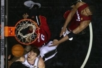 June 5, 2014, San Antonio, TX, USA; San Antonio Spurs center Tiago Splitter (22) shoots the ball against Miami Heat forward LeBron James (6) in game one of the 2014 NBA Finals at AT&T Center. Mandatory Credit: Andy Lyons/Pool Photo via USA TODAY Sports