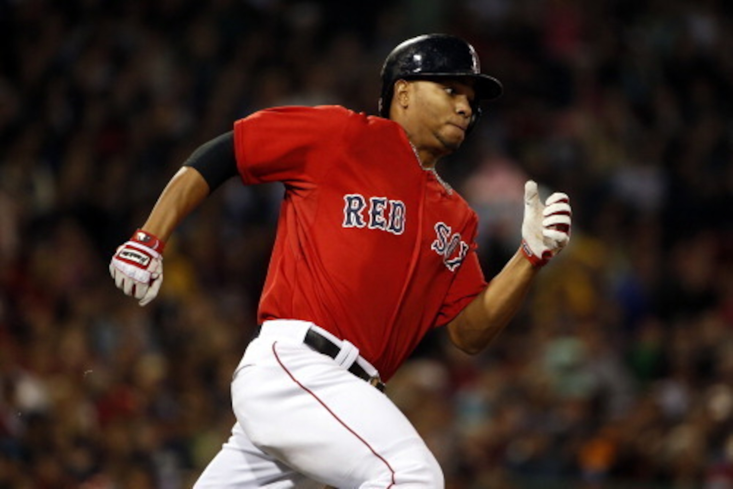 BOSTON, MA - May 30: Xander Bogaerts #2 of the Boston Red Sox runs out a double against the Tampa Bay Rays during the seventh inning of the game at Fenway Park on May 30, 2014 in Boston, Massachusetts. (Photo by Winslow Townson/Getty Images)