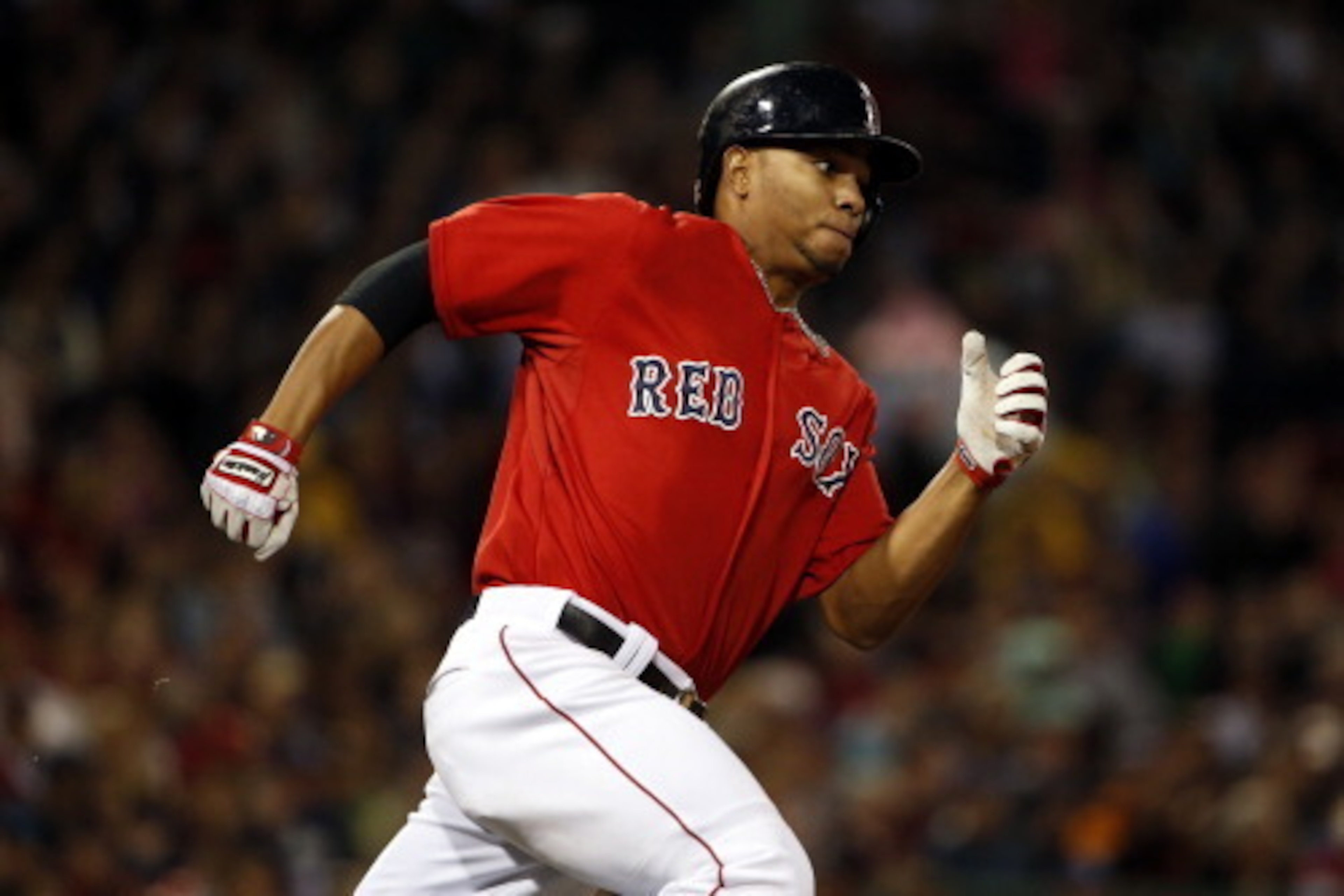 BOSTON, MA - May 30: Xander Bogaerts #2 of the Boston Red Sox runs out a double against the Tampa Bay Rays during the seventh inning of the game at Fenway Park on May 30, 2014 in Boston, Massachusetts. (Photo by Winslow Townson/Getty Images)