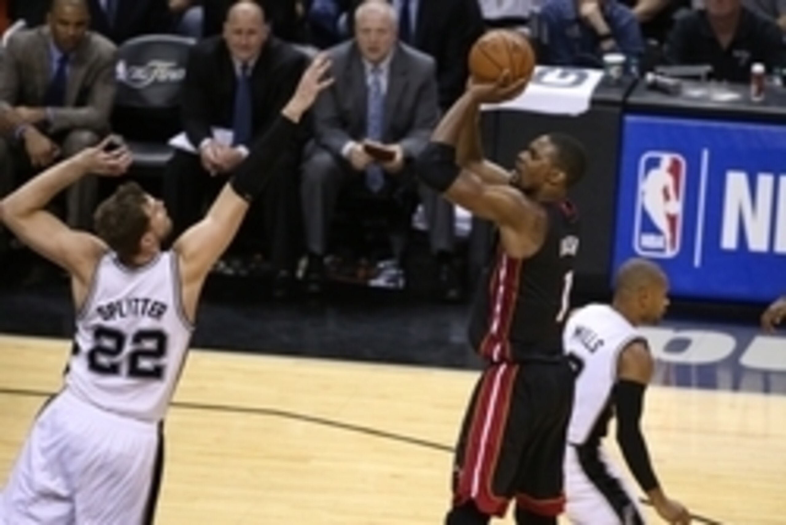 Jun 8, 2014; San Antonio, TX, USA; Miami Heat forward Chris Bosh (1) shoots against San Antonio Spurs froward Tiago Splitter (22) in game two of the 2014 NBA Finals at AT&T Center. Mandatory Credit: Soobum Im-USA TODAY Sports