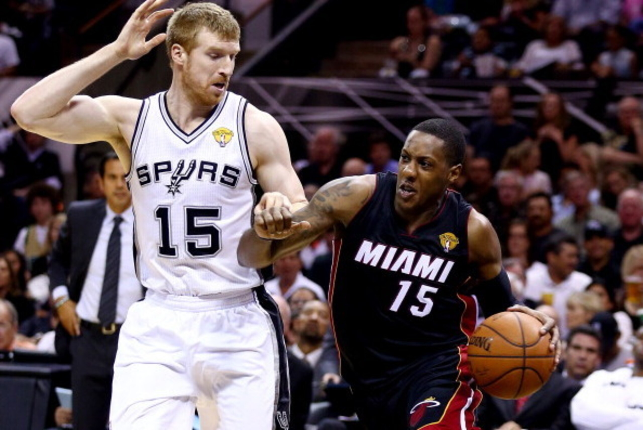 SAN ANTONIO, TX - JUNE 08:  Mario Chalmers #15 of the Miami Heat drives to the basket against Matt Bonner #15 of the San Antonio Spurs during Game Two of the 2014 NBA Finals at the AT&T Center on June 8, 2014 in San Antonio, Texas. NOTE TO USER: User expr