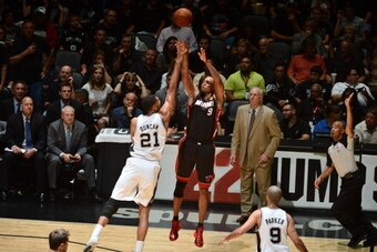 SAN ANTONIO, TX - JUNE 8:  Rashard Lewis #9 of the Miami Heat takes a three pointer against Tim Duncan #21 of the San Antonio Spurs during Game Two of the 2014 NBA Finals at AT&T Center on June 8, 2014 in San Antonio, Texas. NOTE TO USER: User expressly a