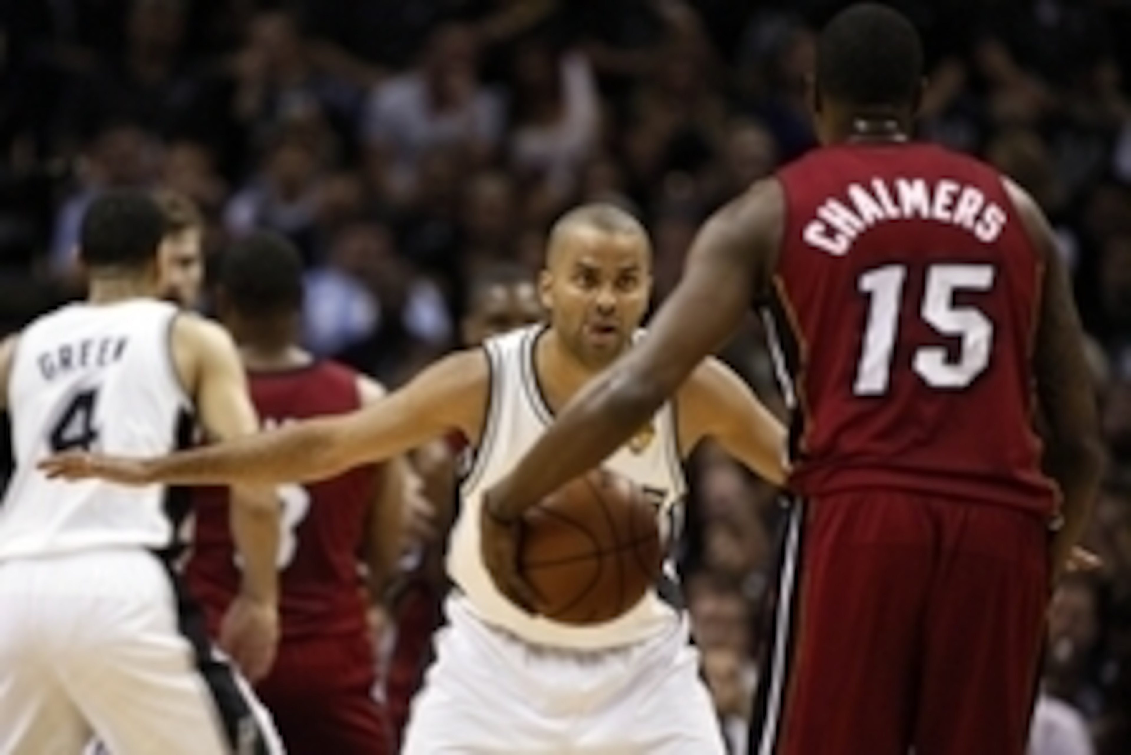 Jun 5, 2014; San Antonio, TX, USA; San Antonio Spurs guard Tony Parker (9) defends Miami Heat guard Mario Chalmers (15) during the first quarter in game one of the 2014 NBA Finals at AT&T Center. Mandatory Credit: Soobum Im-USA TODAY Sports