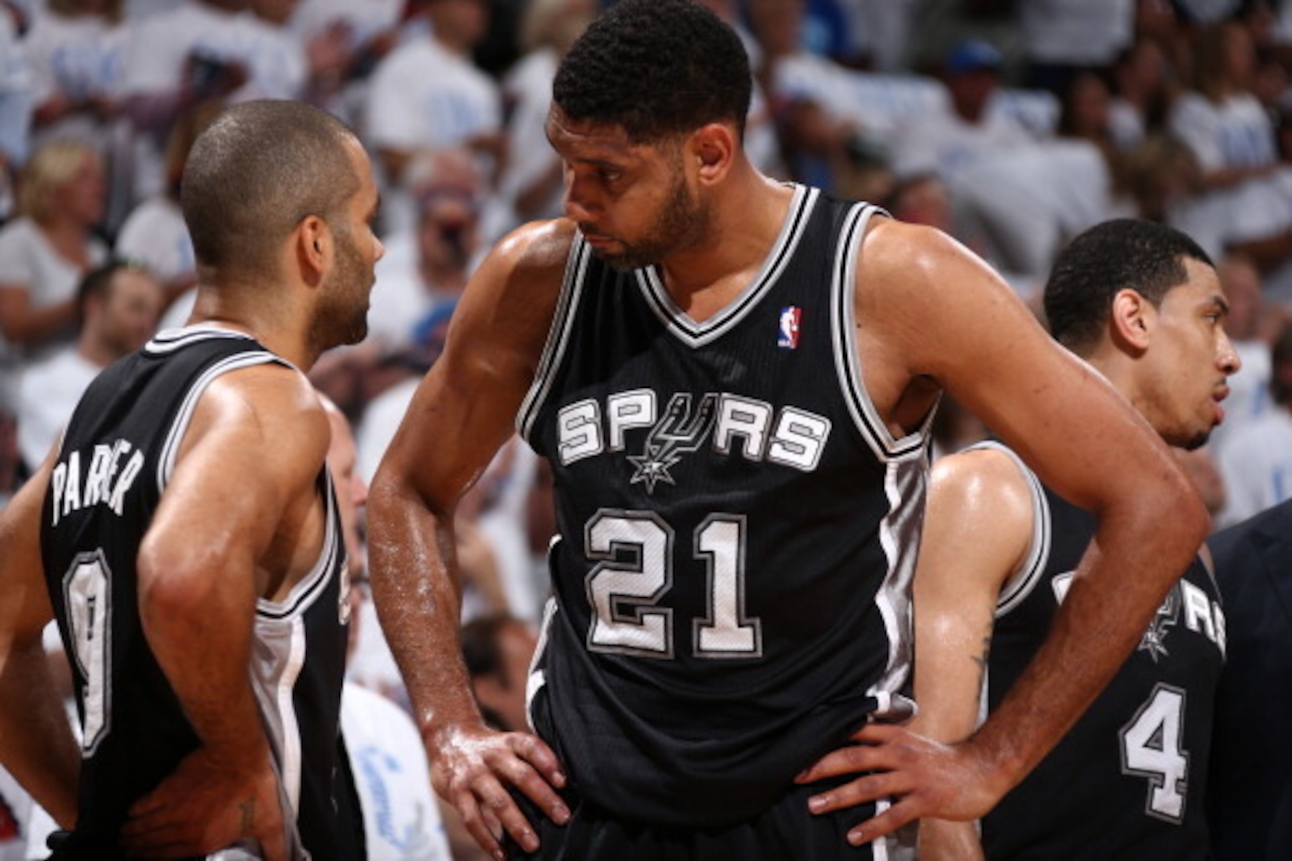 OKLAHOMA CITY, OK - May 31: Tim Duncan #21 and Tony Parker #9 of the San Antonio Spurs talk things over against the Oklahoma City Thunder in Game 6 of the Western Conference Finals during the 2014 NBA Playoffs at the Chesapeake Arena on May 31, 2014 in Ok